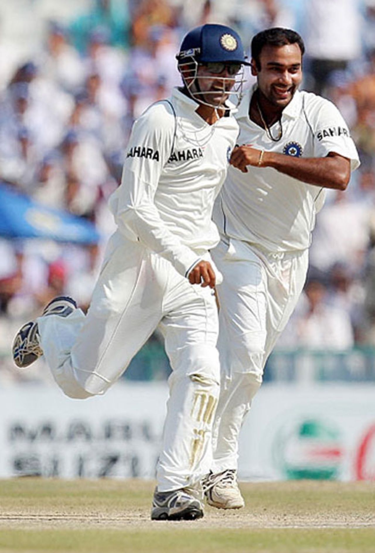 Amit Mishra and Gautam Gambhir run to grab the stumps after the fall of the last Australian wicket, India v Australia, 2nd Test, Mohali, 5th day, October 21, 2008