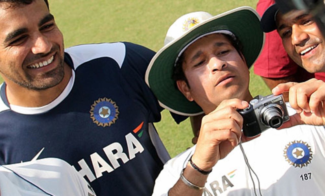 Sachin Tendulkar takes photos of the post-match presentation while Zaheer Khan and Virender Sehwag look on, India v Australia, 2nd Test, Mohali, 5th day, October 21, 2008