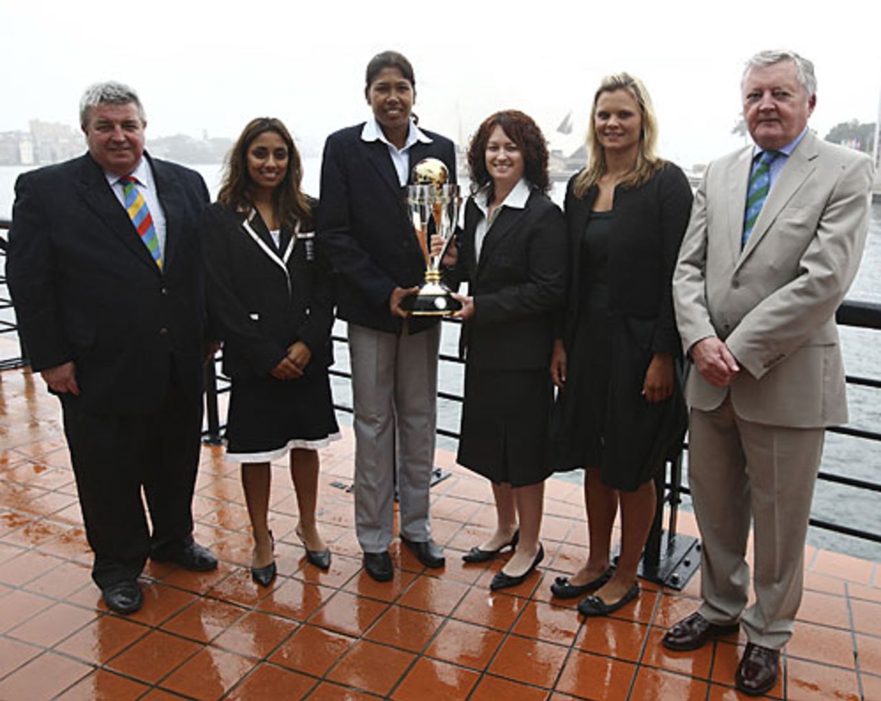 Jack Clarke, the chairman of Cricket Australia, Isa Guha, Jhulan Goswami, Karen Rolton, Suzie Bates and David Morgan, the ICC president, with the World Cup trophy, Sydney, October 29, 2008