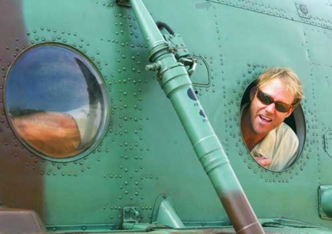 Matthew Hayden of Australia looks out of an Air Force Helicopter before flying to Kandy with his team mates, March 13, 2004