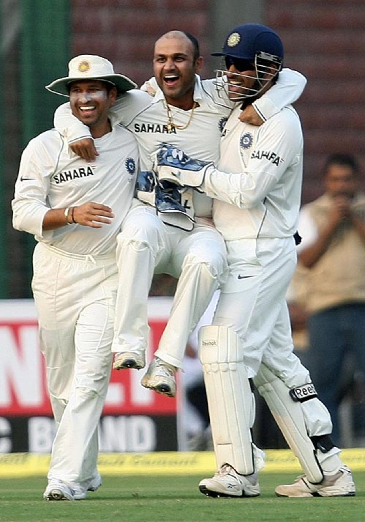 Sachin Tendulkar and Mahendra Singh Dhoni congratulate Virender Sehwag after the fall of Michael Hussey's wicket, India v Australia, 3rd Test, Delhi, 3rd day, October 31, 2008