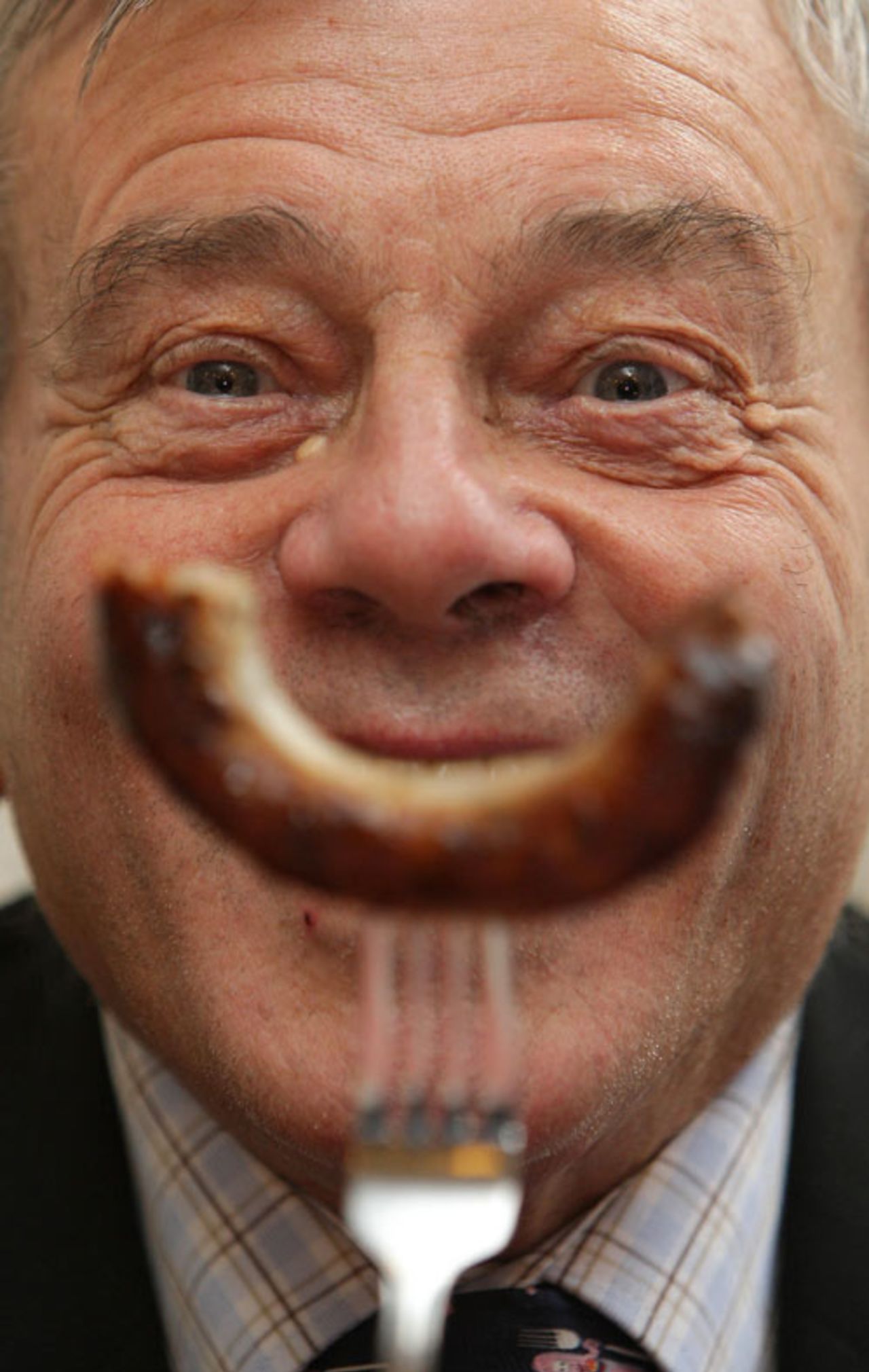 Former cricket umpire Dickie Bird takes part in the judging of the London heat of the 'Britain's Landmark Bangers' competition, S&M Cafe, Shoreditch, London, November 3, 2008