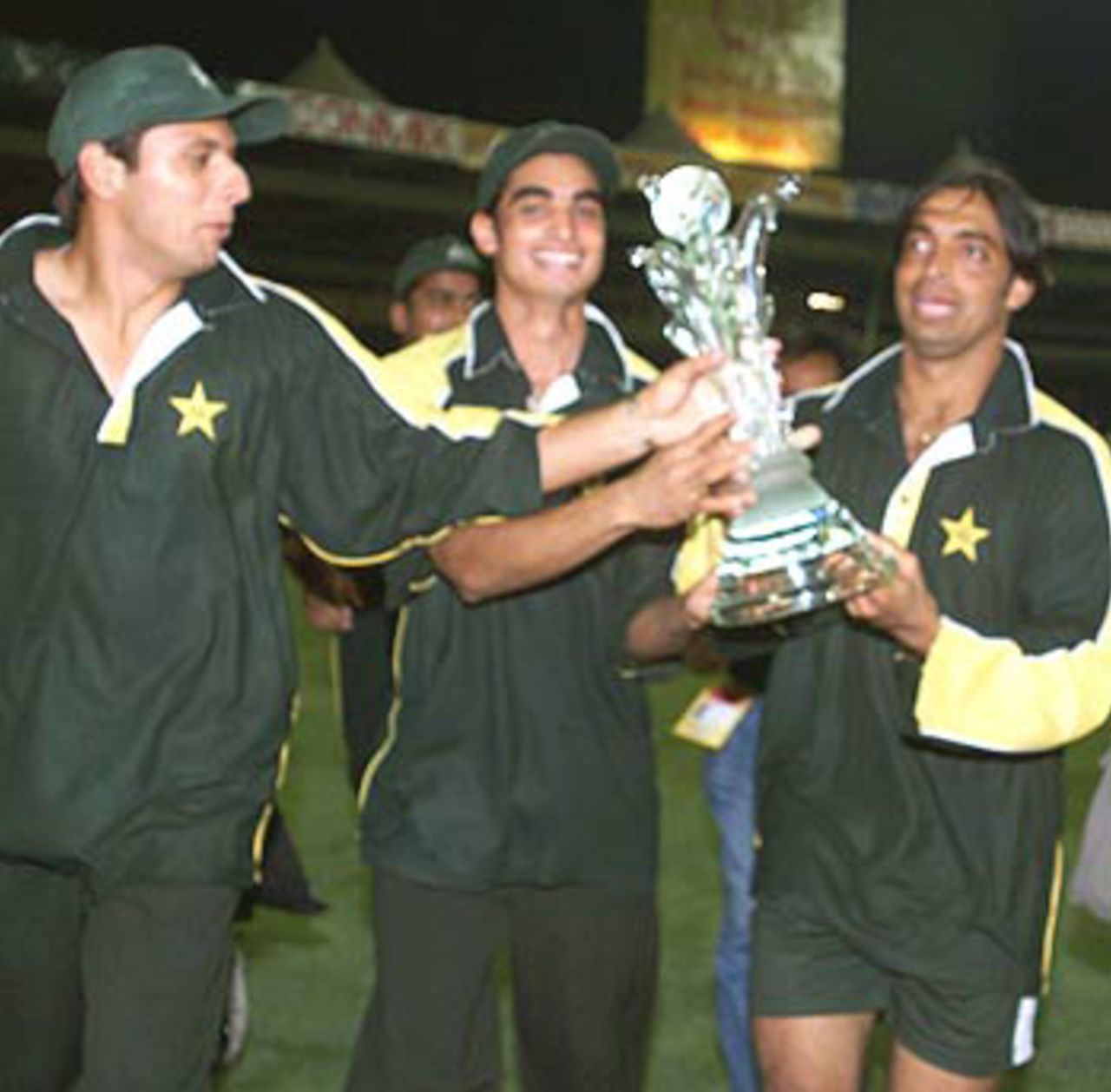 Shahid Afridi, Imran Nazir and Shoaib Akhtar exult after Pakistan lift the Coca Cola Cup 2000, Pakistan v South Africa, Coca-Cola Cup 1999/00, Final, Sharjah C.A. Stadium, 31 March 2000.
