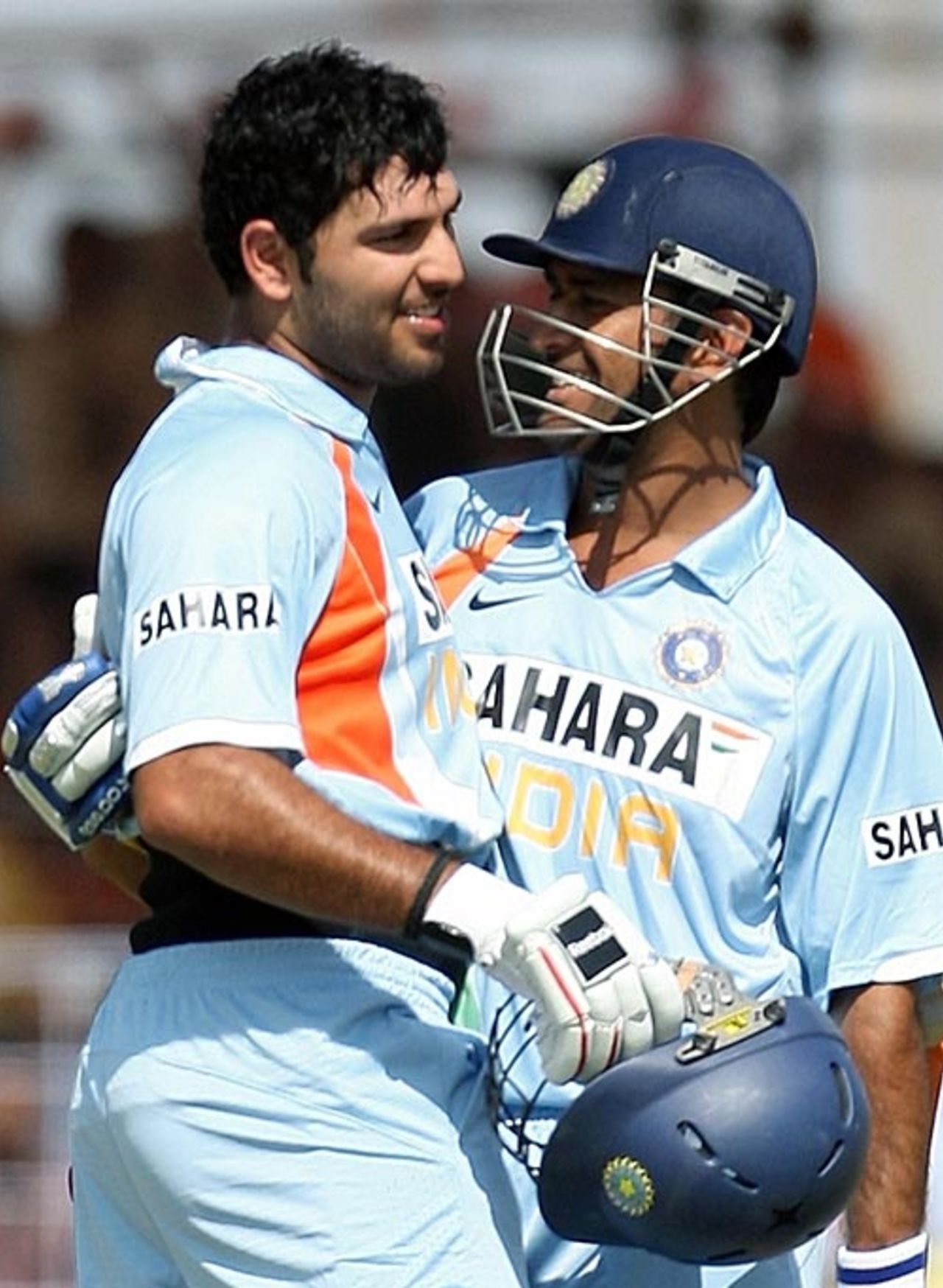 Yuvraj Singh is congratulated by Mahendra Singh Dhoni on reaching his hundred, India v England, 1st ODI, Rajkot, November 14, 2008