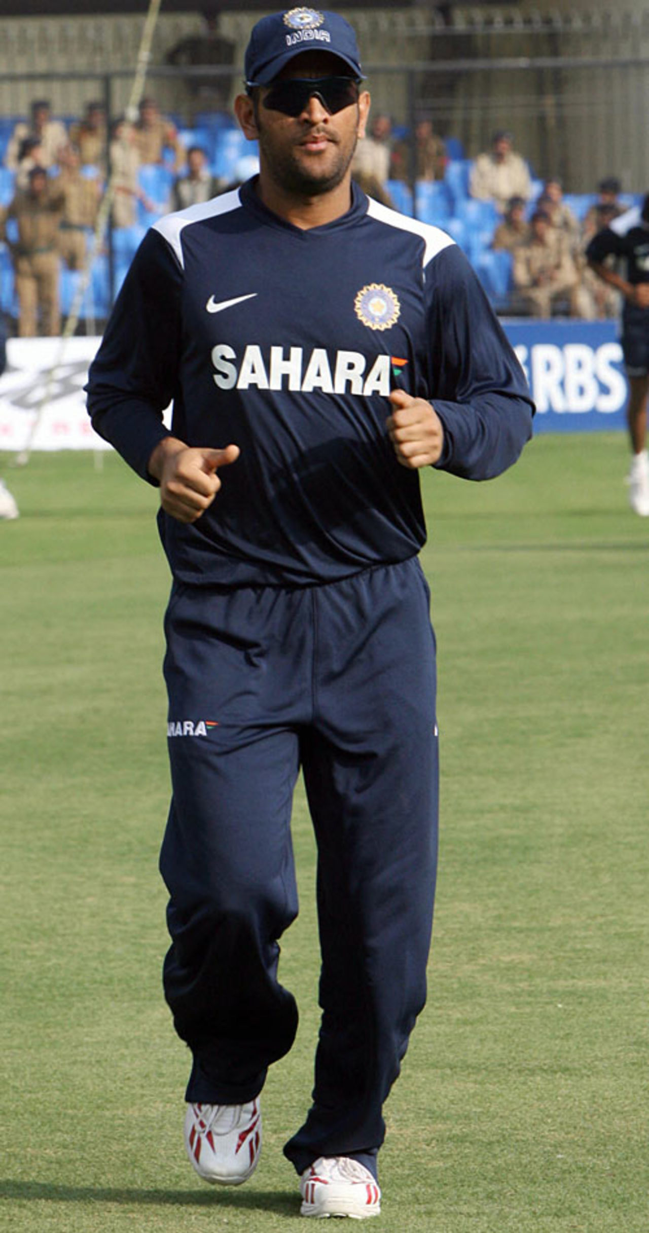 Mahendra Singh Dhoni jogs during a training session on the eve of the second ODI against England, Indore, November 16, 2008