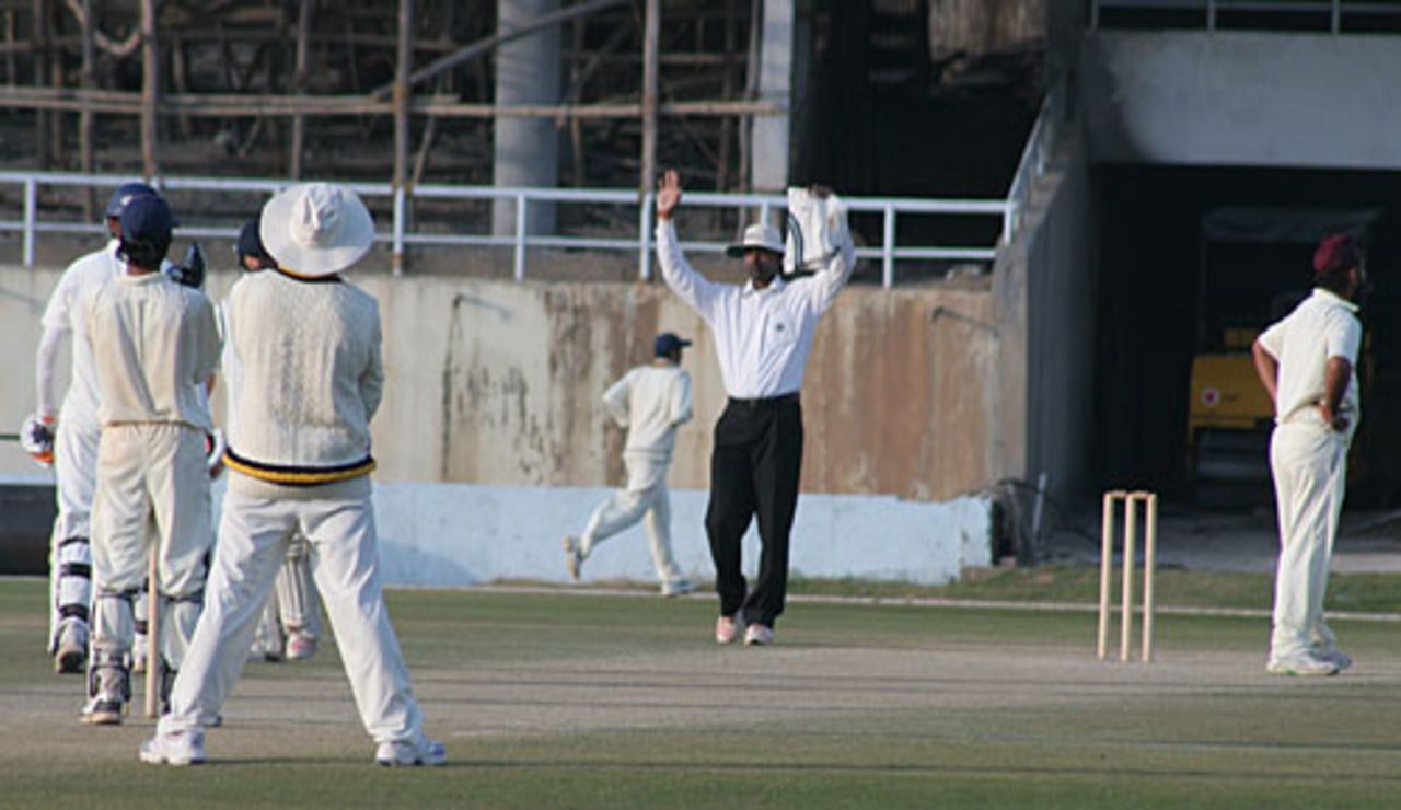The umpire signals a six hit by Samiullah Beigh off Sarandeep Singh, Himachal Pradesh v Jammu & Kashmir, Ranji Plate League, 3rd day, Dharamsala, November 18, 2008