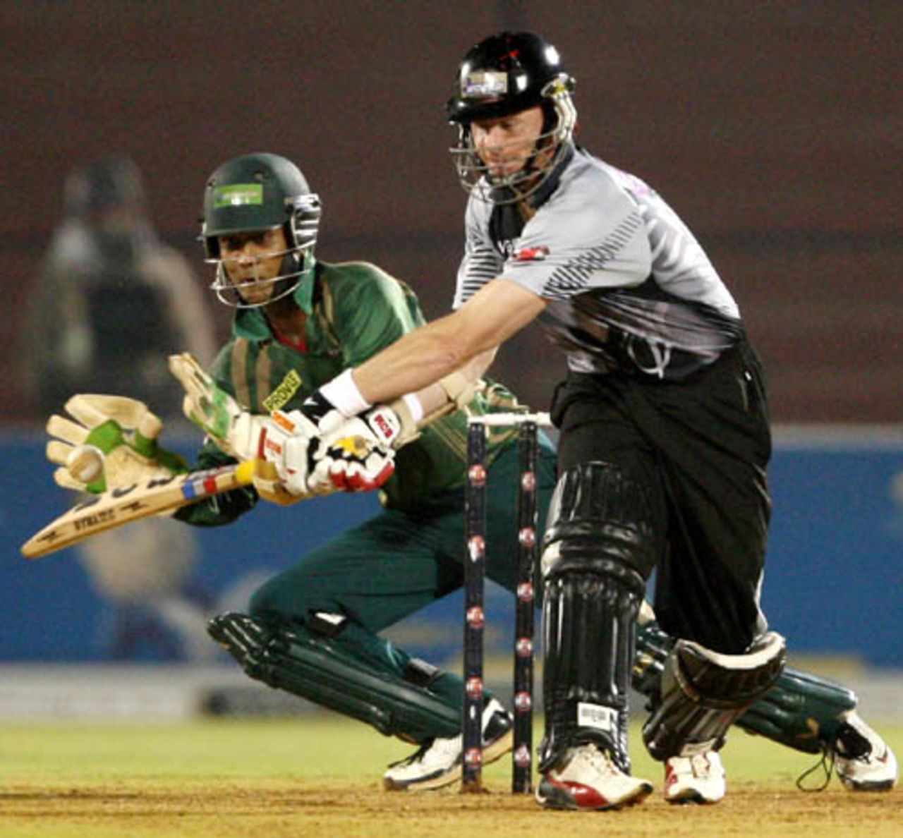 Dhiman Ghosh looks to collect the ball down the leg side, ICL Bangladesh XI v ICL World XI, Ahmedabad, November 23, 2008