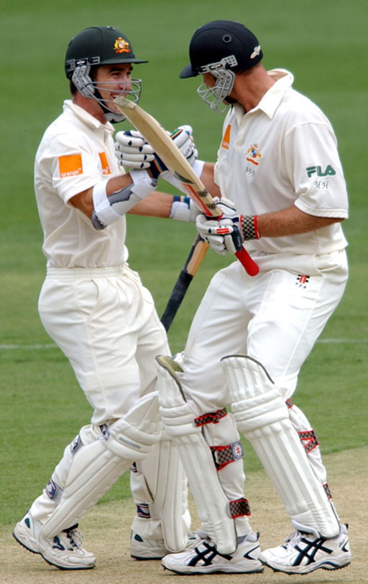 Justin Langer congratulates Matthew Hayden on reaching his century, Australia v New Zealand, 1st Test, Brisbane, 1st day, November 8, 2001.