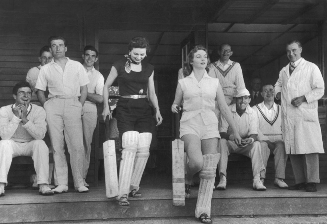 Jan Richards and her friend Marguerite Lynd prepare to take part in a village cricket match, August 7, 1954
