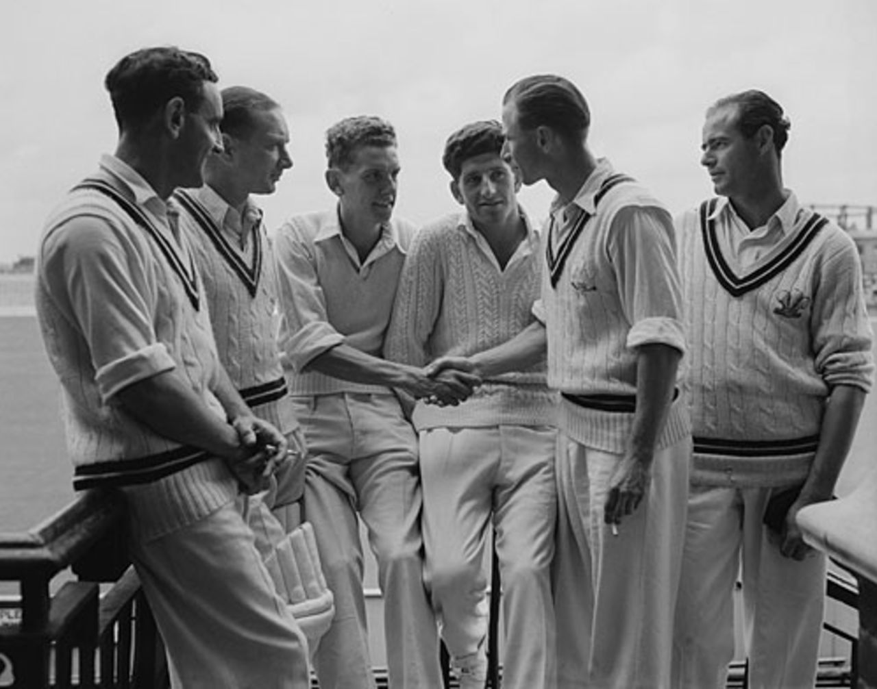 Peter Loader is congratulated by David Fletcher (standing) for his 8 for 21 as Bernie Constable, Arthur McIntyre, Ken Barrington and John McMahon look on, Surrey v Worcestershire, County Championship, 2nd day, The Oval, July 16, 1953