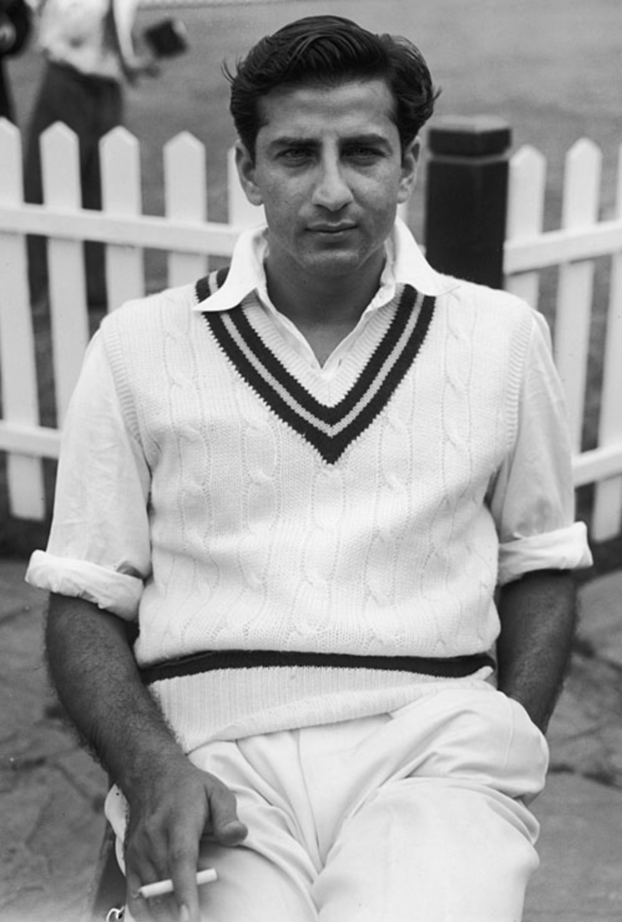 Fazal Mahmood takes a cigarette break during a match, 1953