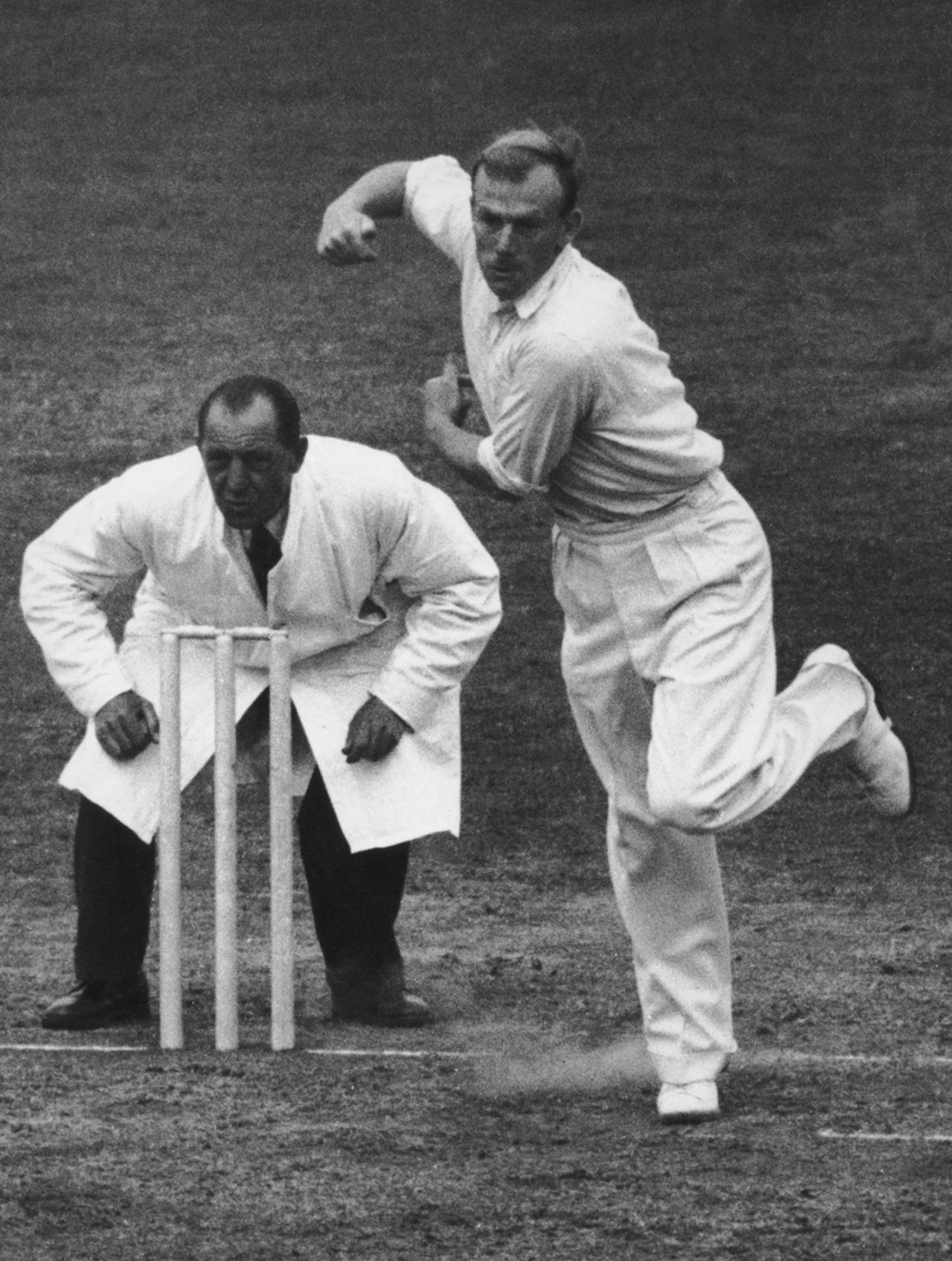 Tony Lock bowls for Surrey, The Oval, 1952
