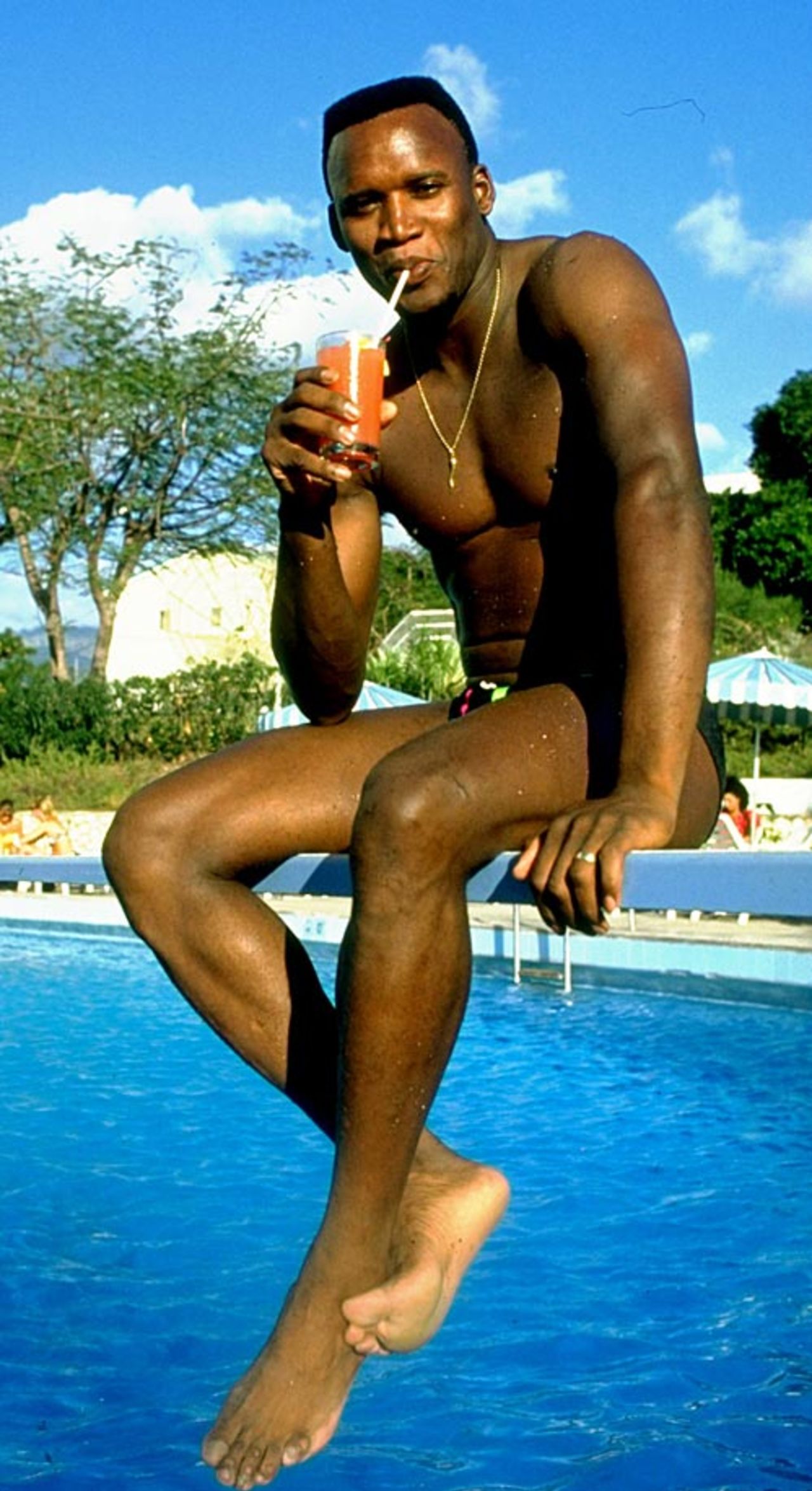 Devon Malcolm relaxes by the pool, Kingston, February 1, 1990
