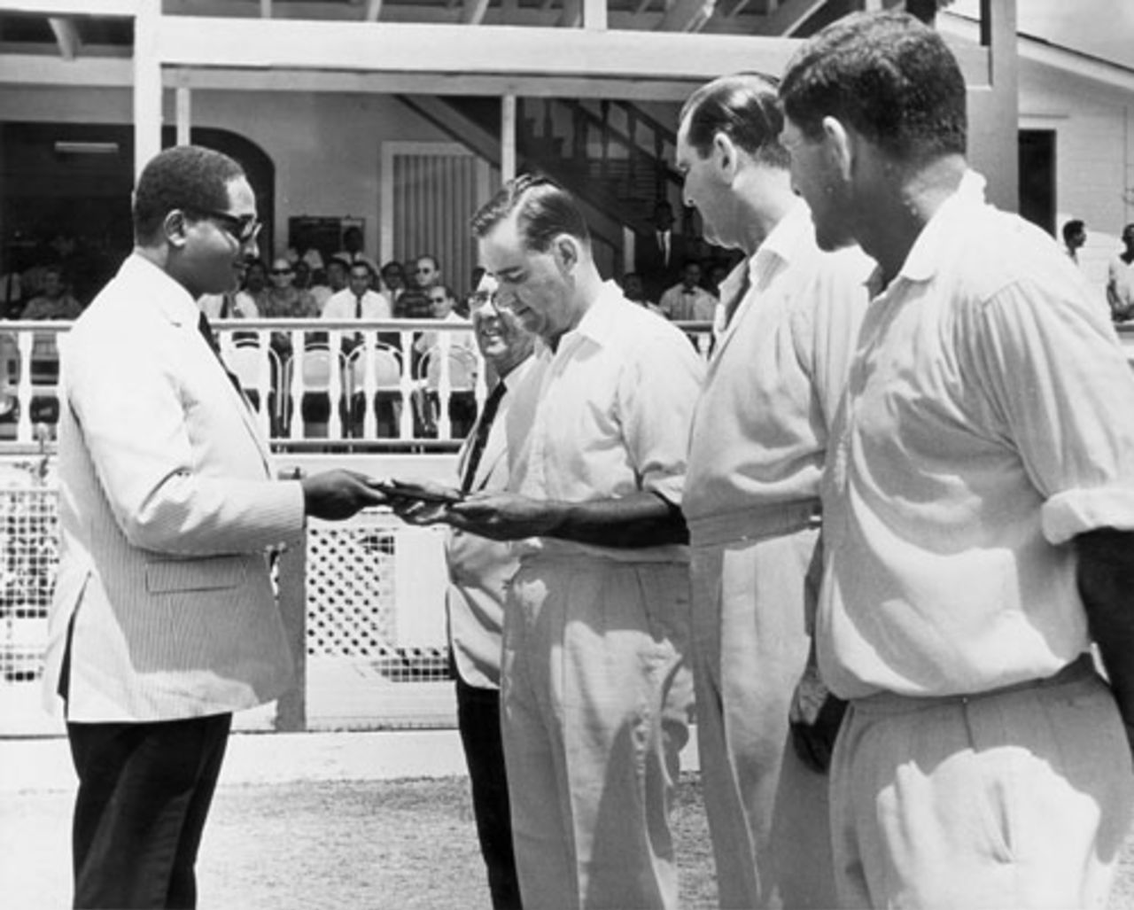 Forbes Burnham, the Guyanese Prime Minister, presents Colin Cowdrey with a set of stamps commemorating the Test series, West Indies v England, 5th Test, Georgetown, 1st day, March 28, 1968