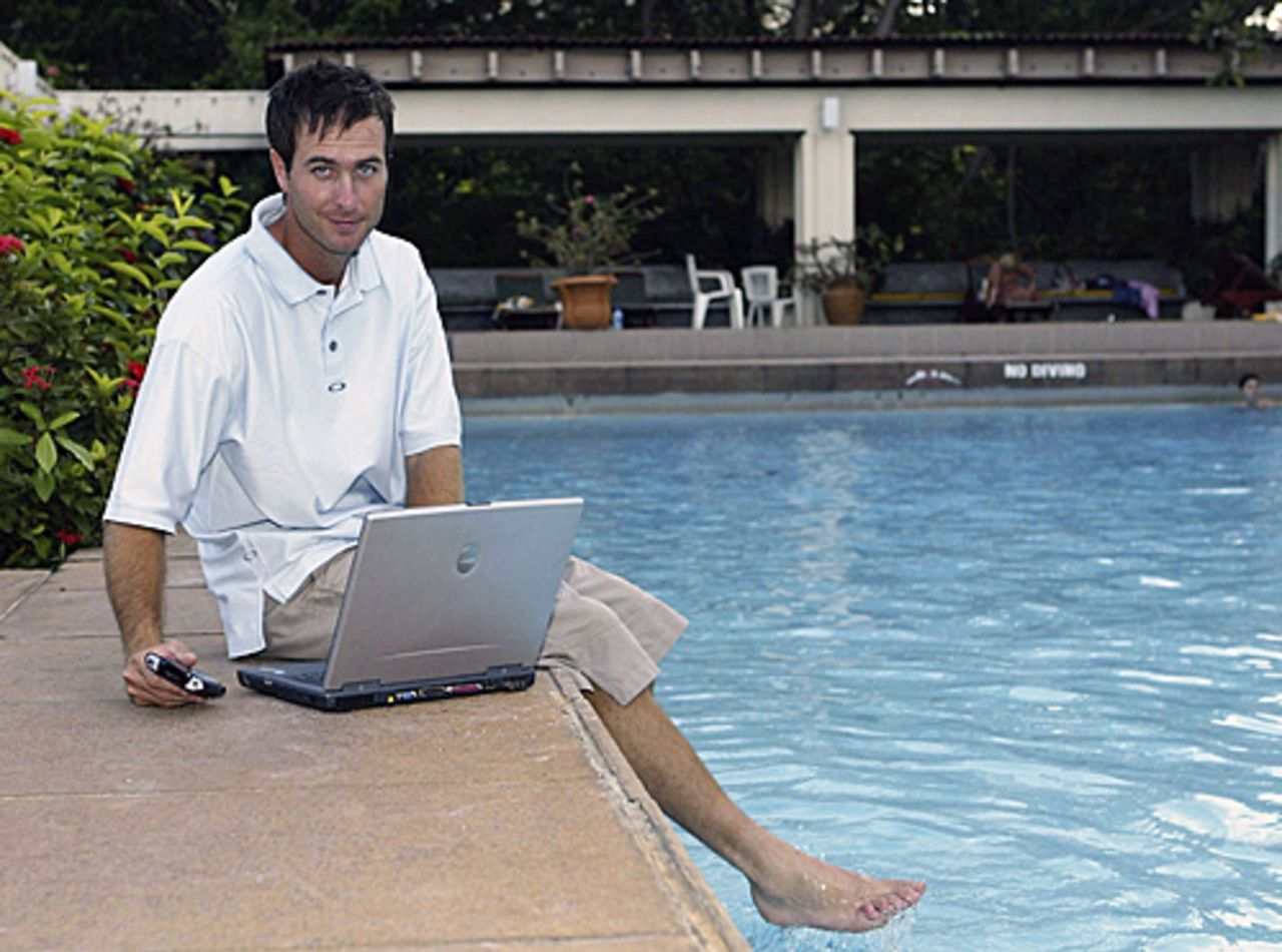 Michael Vaughan with his laptop by the pool, England in Sri Lanka, December 13, 2003