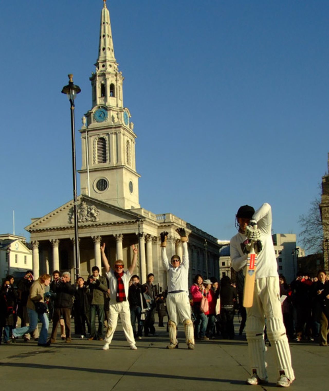 A group of fund-raisers hold a "freeze mob" in Trafalgar Square to promote their aim to play the world's highest-ever cricket match, London, December 6, 2008