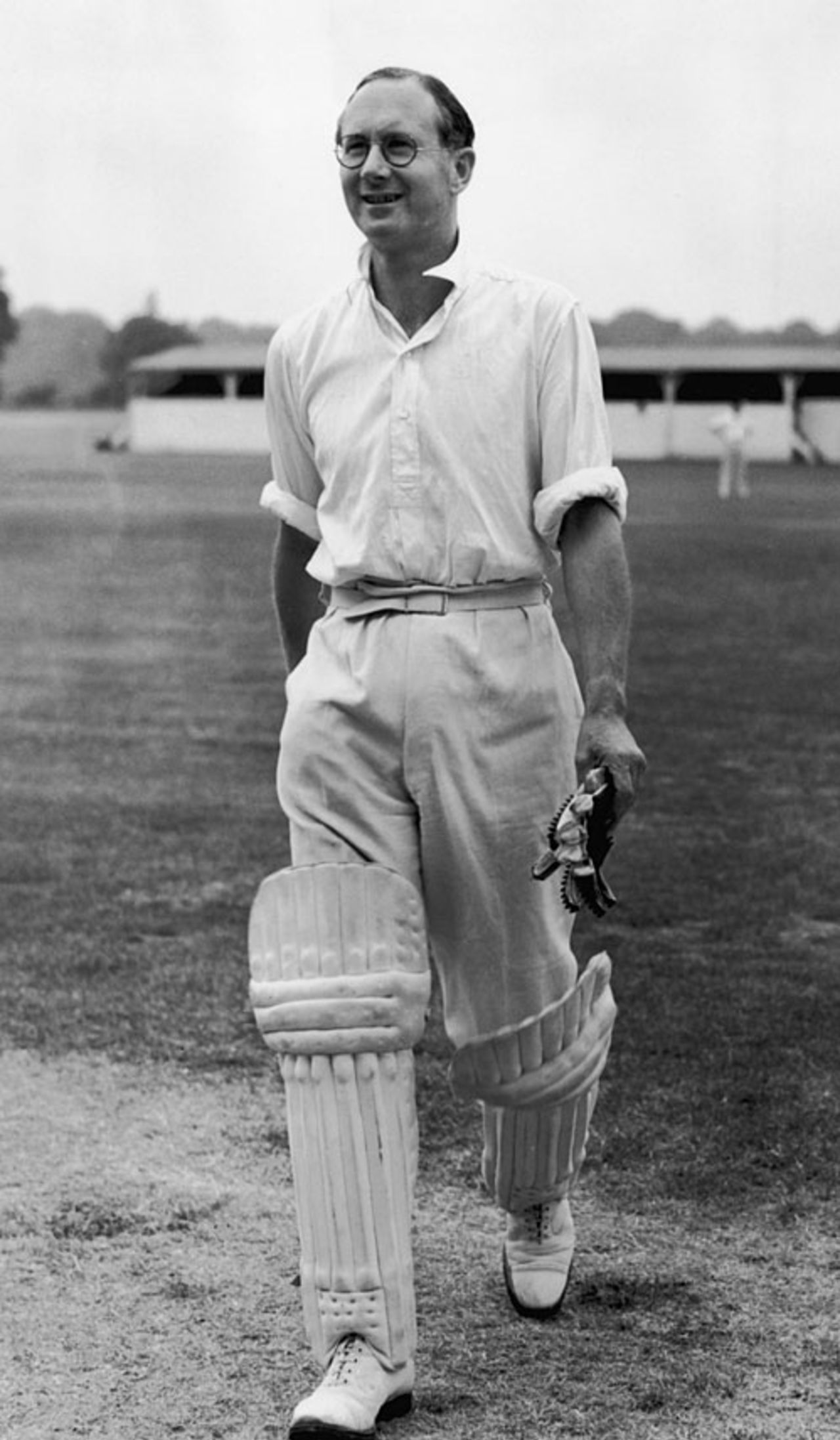 BBC commentator Rex Alston walks back after his innings in a charity game against London footballers, London, July 13, 1949