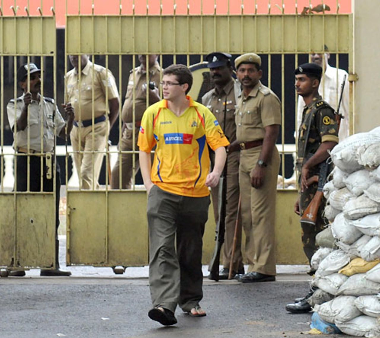 A fan walks into the heavily guarded MA Chidambaram Stadium before England's first practice session, Chennai, December 9, 2008
