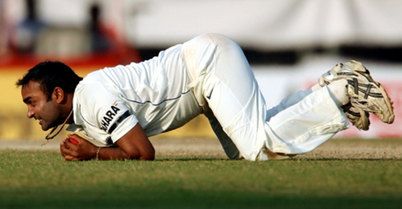 Amit Mishra tumbles low to take a catch off Andrew Strauss , India v England, 1st Test, Chennai, 1st day, December 11, 2008