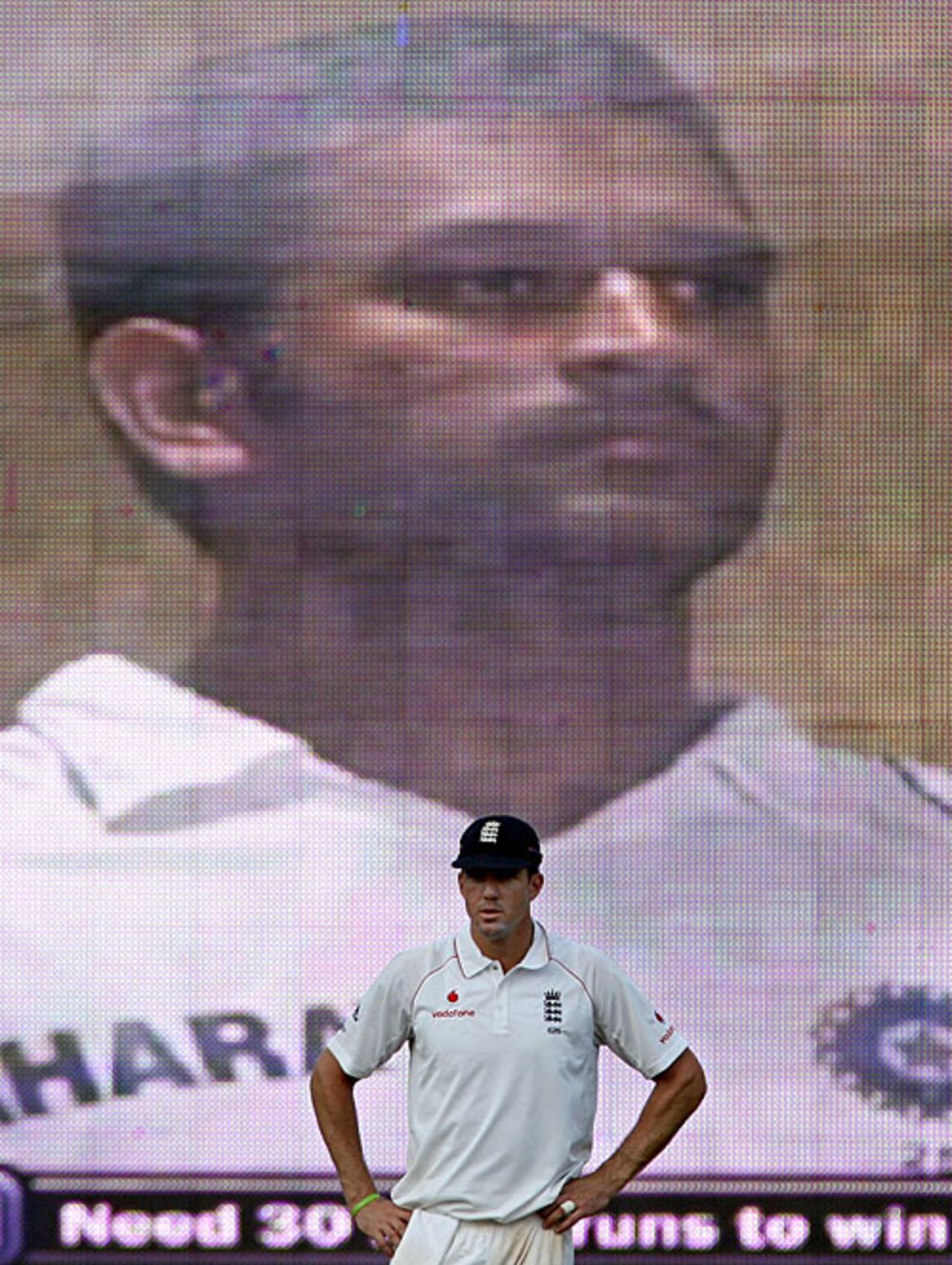 Mahendra Singh Dhoni looms large on the big screen behind Kevin Pietersen, India v England, 1st Test, Chennai, 5th day, December 15, 2008