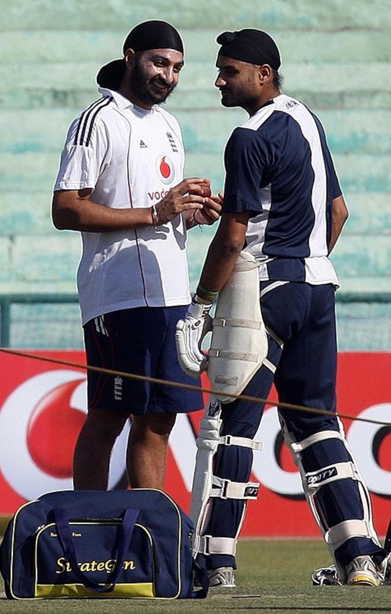 Monty Panesar and Harbhajan Singh have a chat during practice, Mohali, December 18, 2008