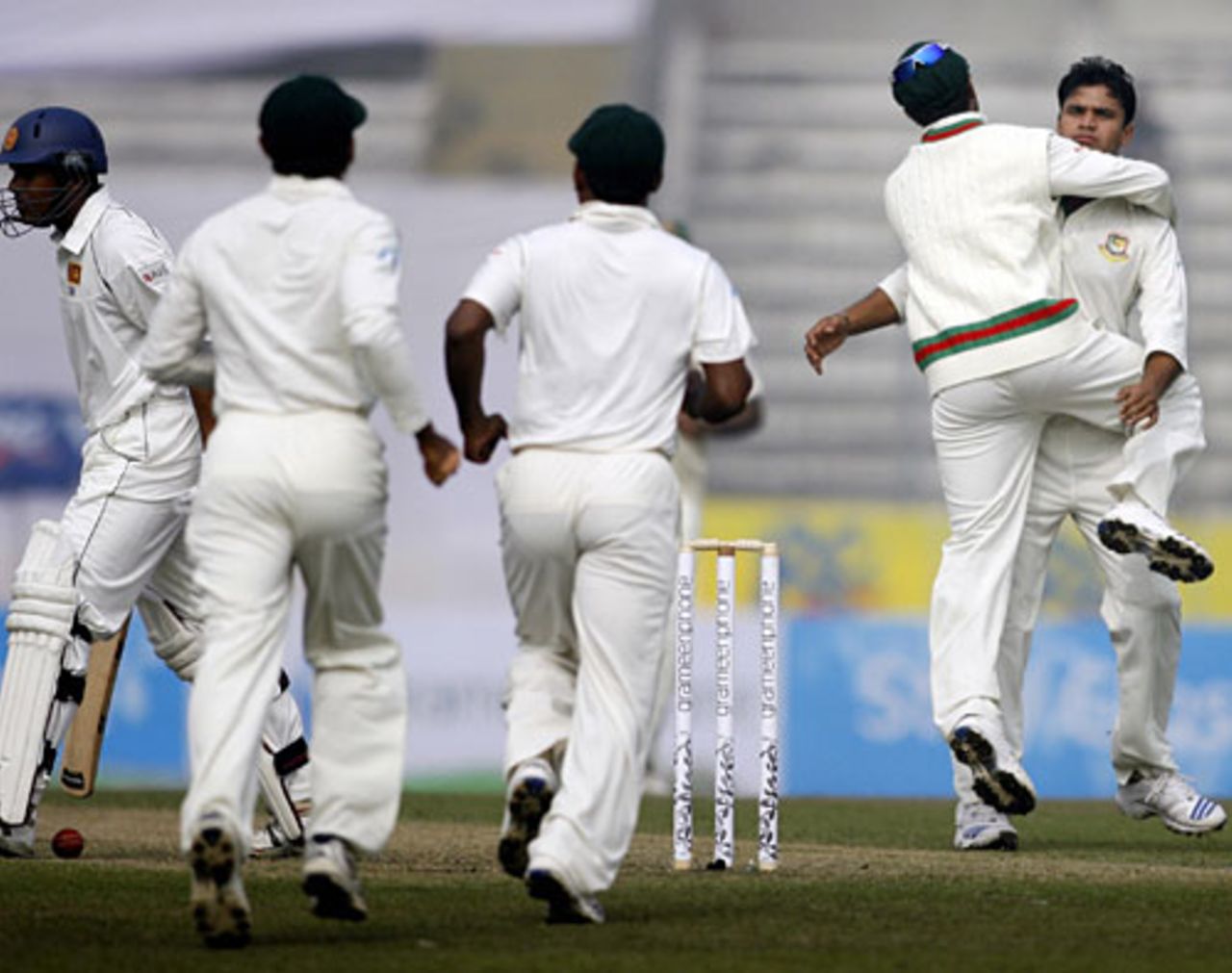 Bangladesh players rush in towards Mashrafe Mortaza after he dismissed Malinda Warnapura, Bangladesh v Sri Lanka, 1st Test, Mirpur, 1st day, December 26, 2008
