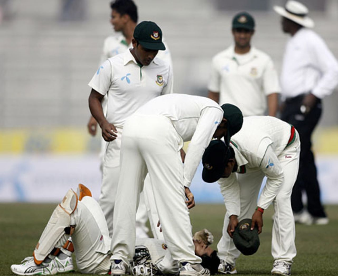 Mushfiqur Rahim is attended to after being struck on the face, Bangladesh v Sri Lanka, 1st Test, Mirpur, 1st day, December 26, 2008