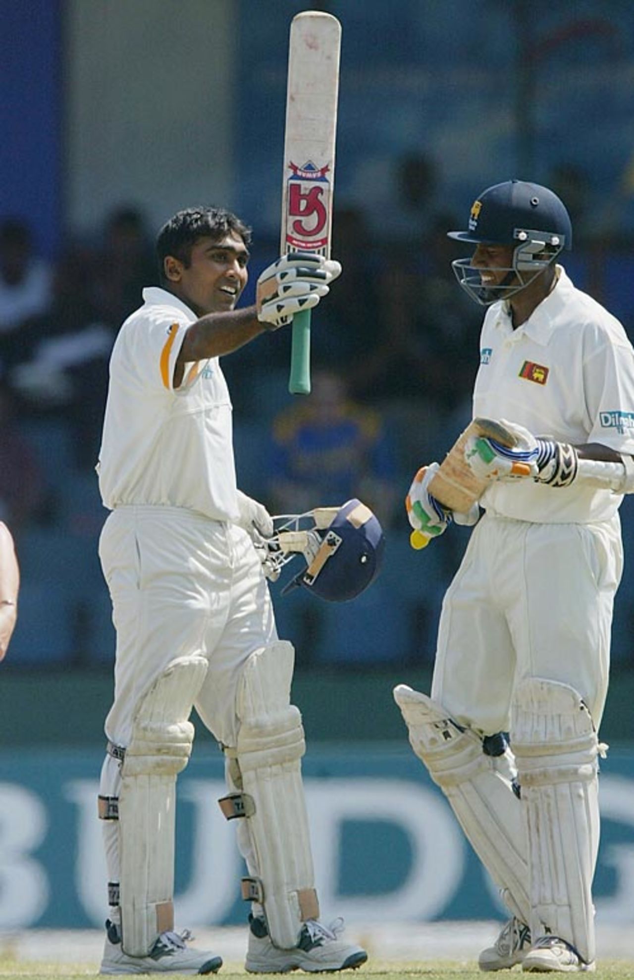Mahela Jayawardene raises his bat and accepts the congratulations from Thilan Samaraweera on reaching his hundred, Sri Lanka v England, 3rd Test, Colombo, 3rd day, December 20, 2003