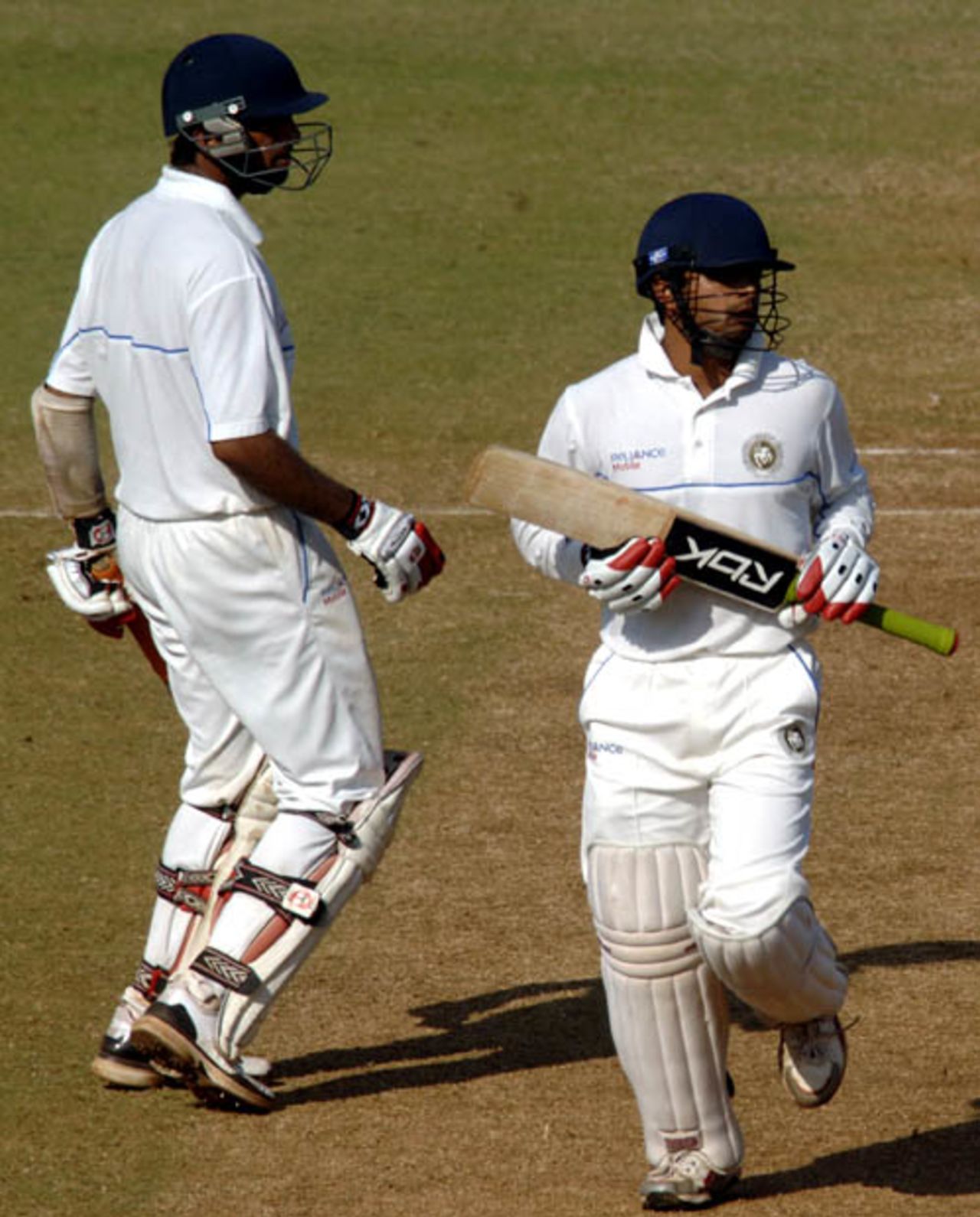 Cheteshwar Pujara and Shitanshu Kotak look on as the ball sails to the boundary, Karnataka v Saurashtra, 2nd quarter-final, Mumbai, Ranji Trophy Super League, 4th day, December 29, 2008