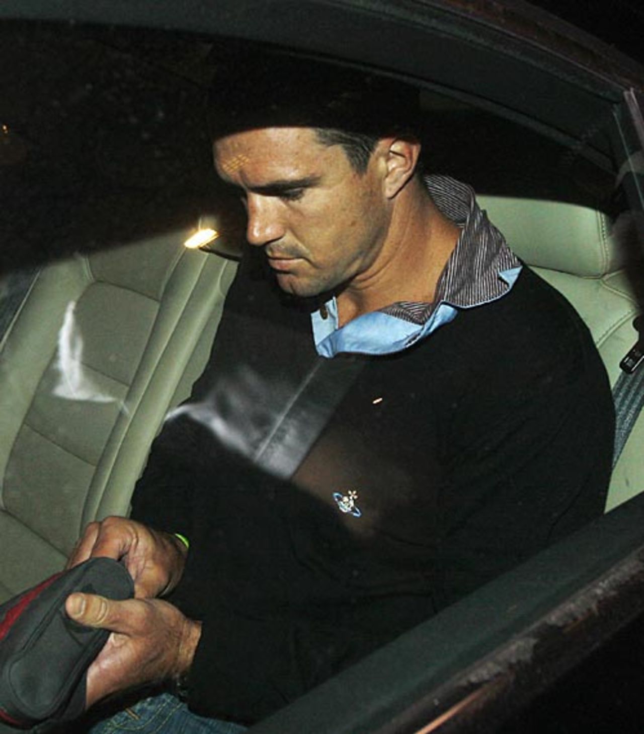 Kevin Pietersen makes his way out of Heathrow Airport under the media glare, London, January 7, 2009