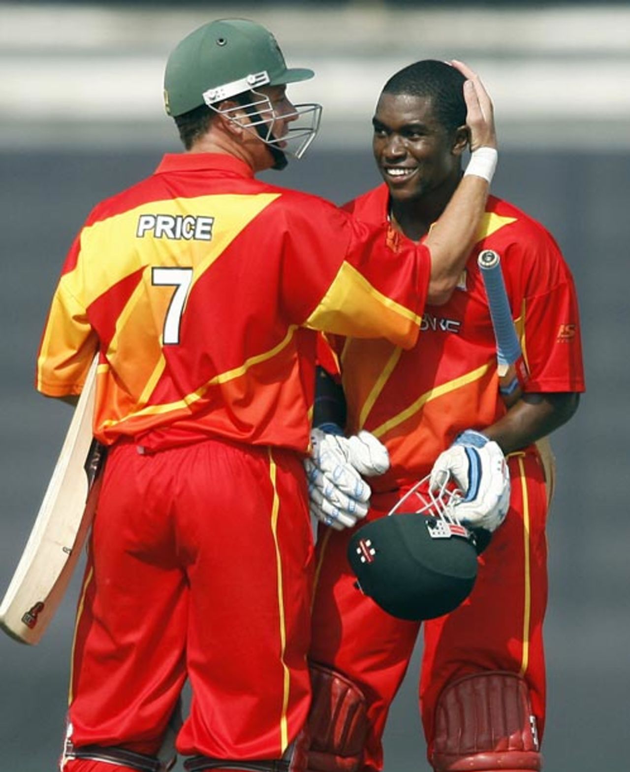 Elton Chigumbura is congratulated by Ray Price on reaching his half-century, Bangladesh v Zimbabwe, 1st ODI, Bangladesh tri-series, Mirpur, January 10, 2009