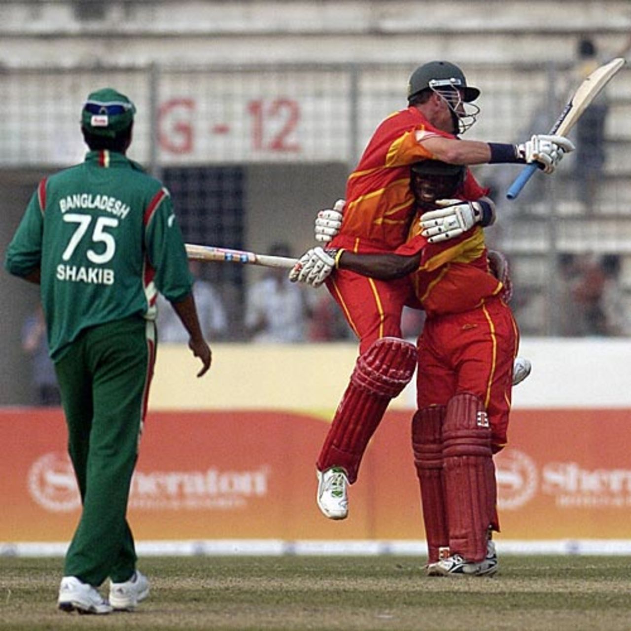 Ray Price and Tawanda Mupariwa celebrate Zimbabwe's win, Bangladesh v Zimbabwe, 1st ODI, Mirpur, January 19, 2009