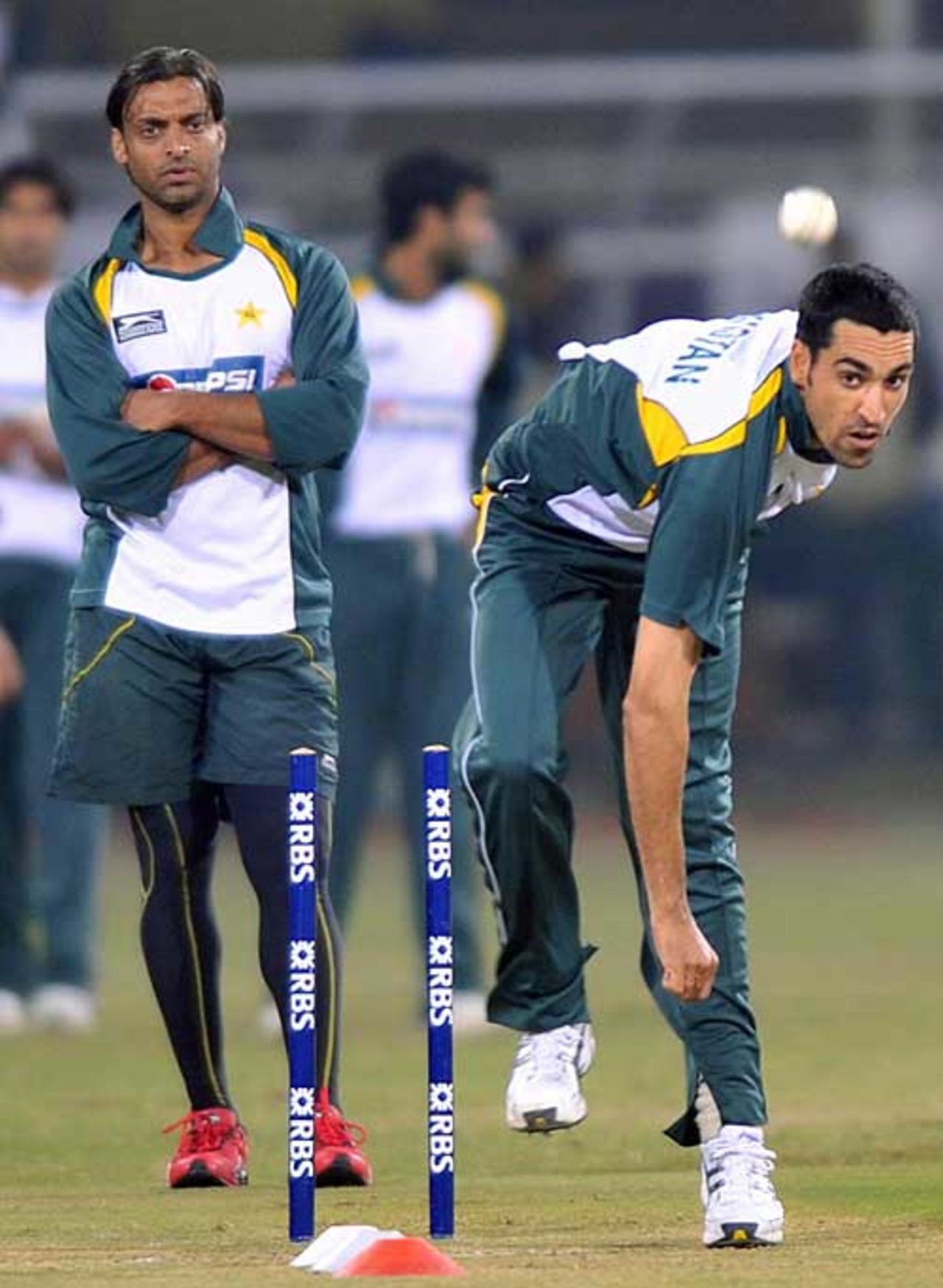 Umar Gul goes through his paces watched by Shoaib Akhtar, Lahore, January 23, 2009