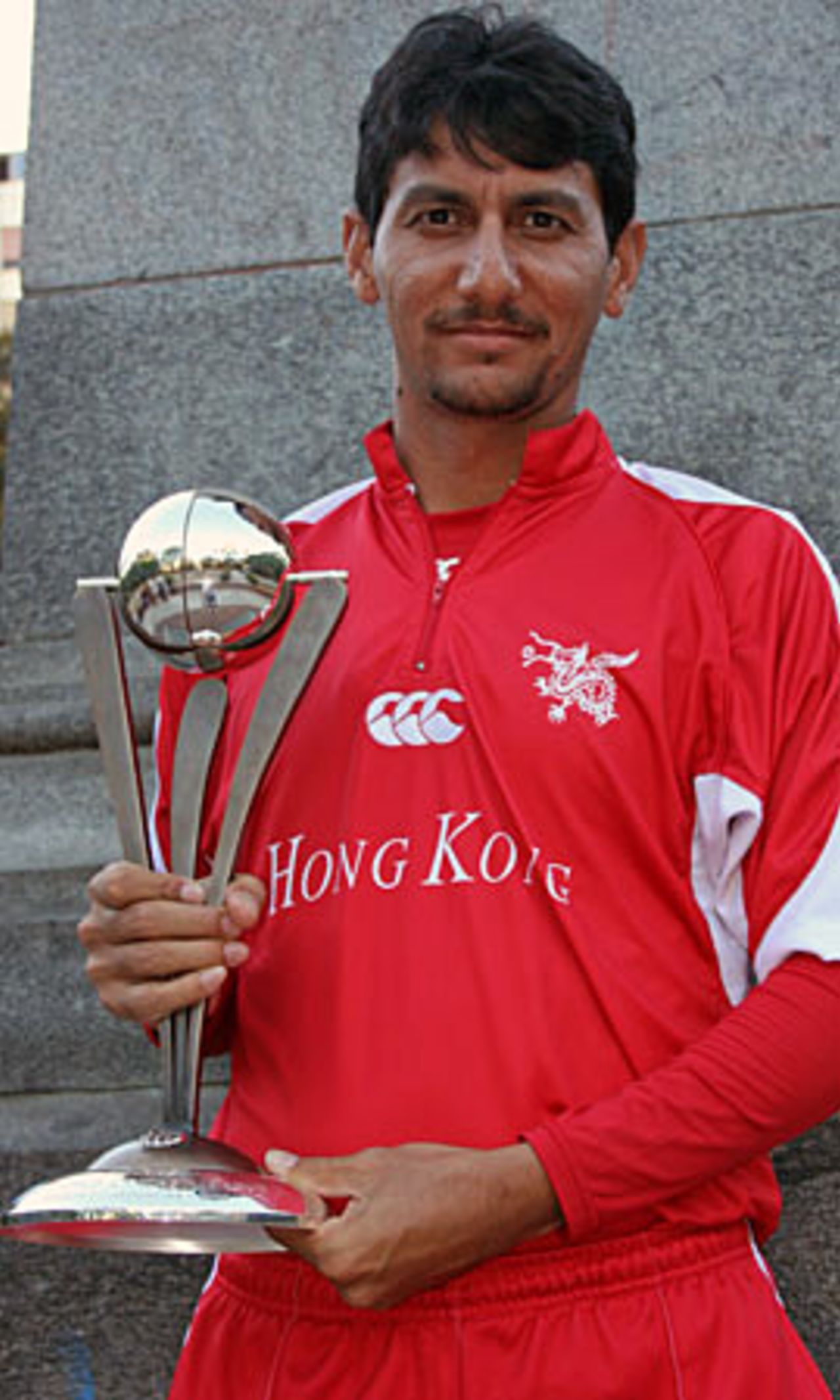 Hong Kong's skipper Tabarak Dar poses with the ICC WCL Division 3 Trophy