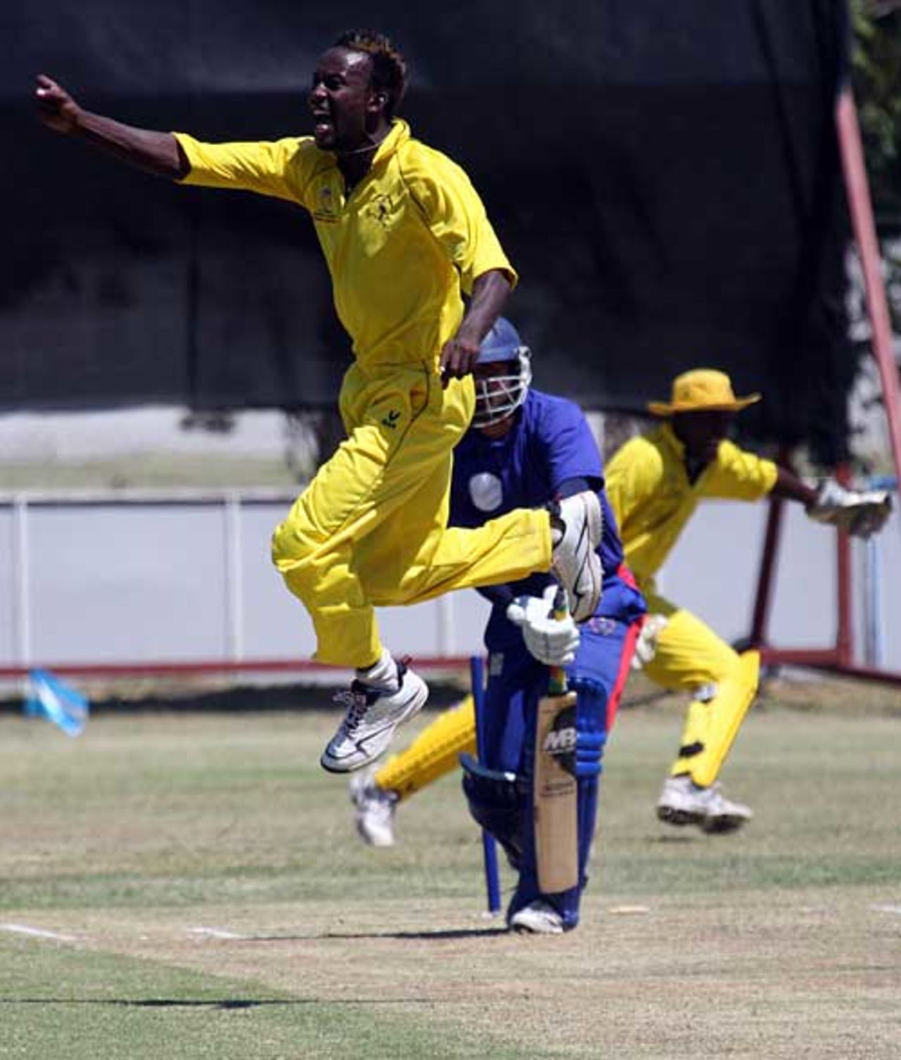 Kenneth Kamyuka jumps for joy as he collects one of his five wickets, Uganda v Afghanistan, Buenos Aires, January 24, 2009
