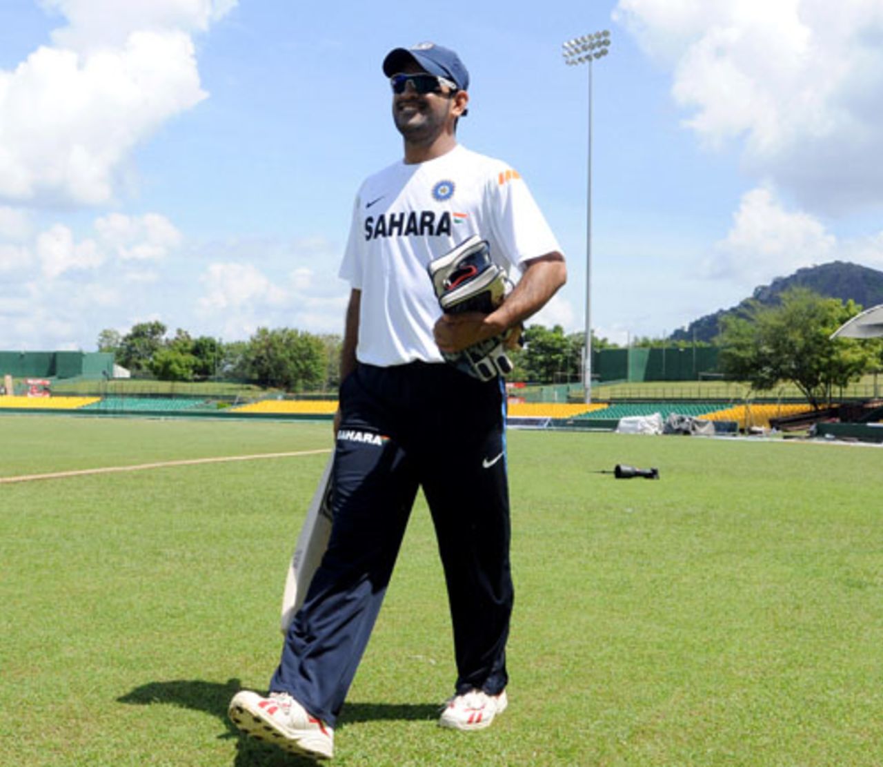 A cheery Mahendra Singh Dhoni walks in for practice, Dambulla, January 27, 2009