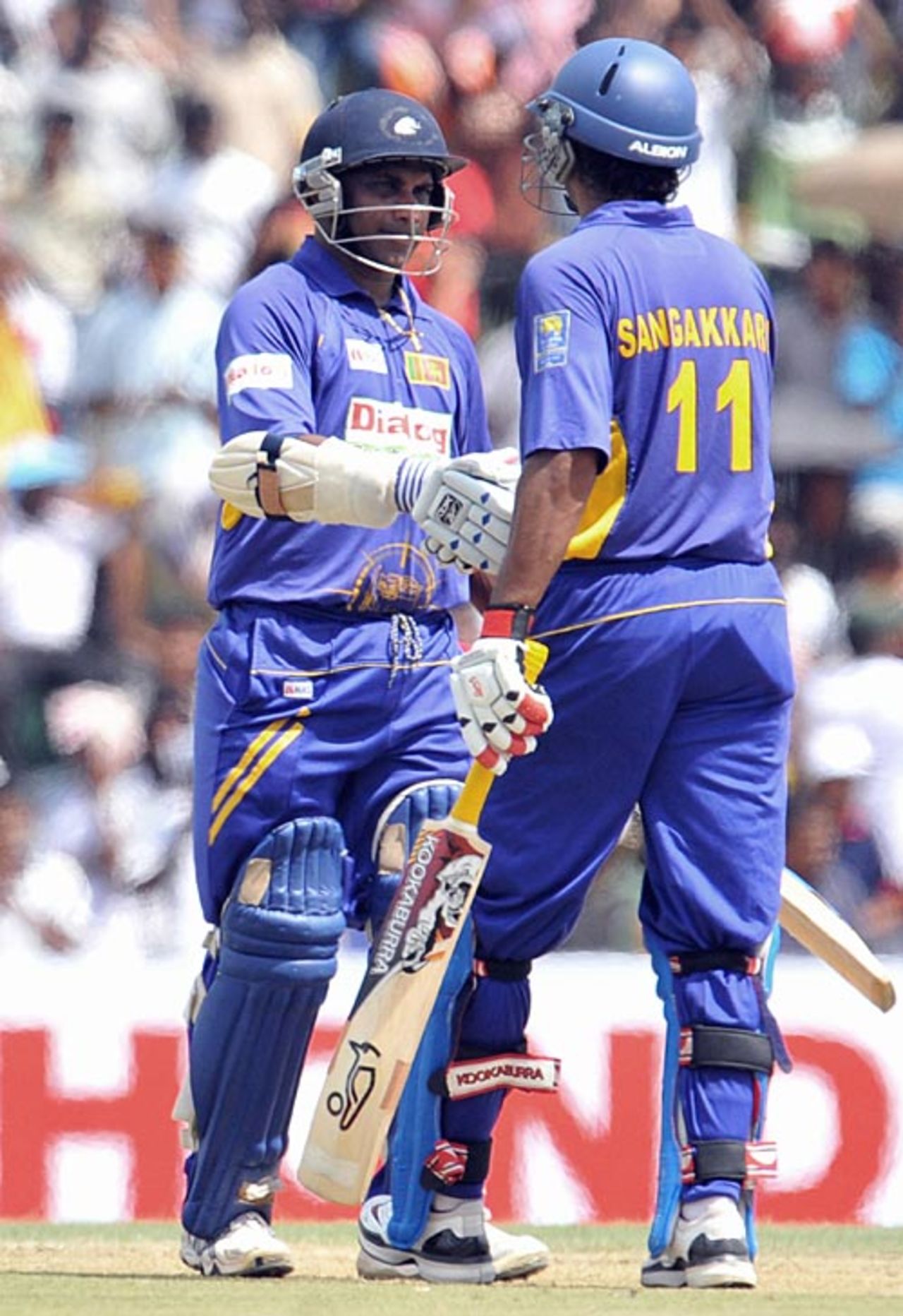 Sanath Jayasuriya is congratulated by Kumar Sangakkara on reaching his fifty, Sri Lanka v India, 1st ODI, Dambulla, January 28, 2009