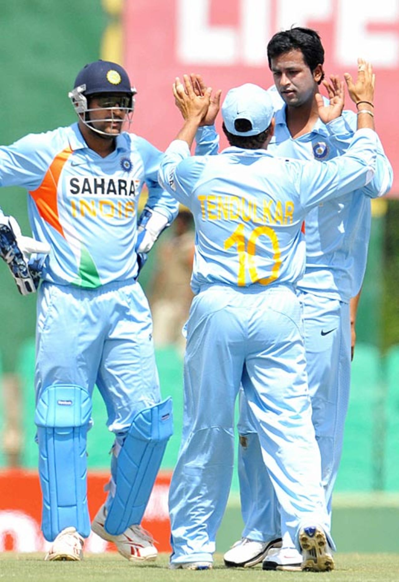 Team-mates congratulate Pragyan Ojha on dismissing Kumar Sangakkara, Sri Lanka v India, 1st ODI, Dambulla, January 28, 2009