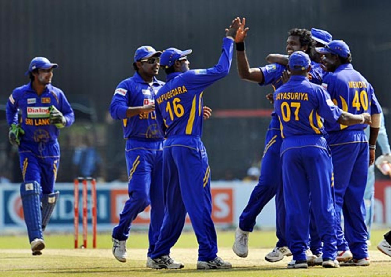 Team-mates mob Dilhara Fernando after he removed Sachin Tendulkar in the second over, Sri Lanka v India, 3rd ODI, Colombo, February 3, 2009