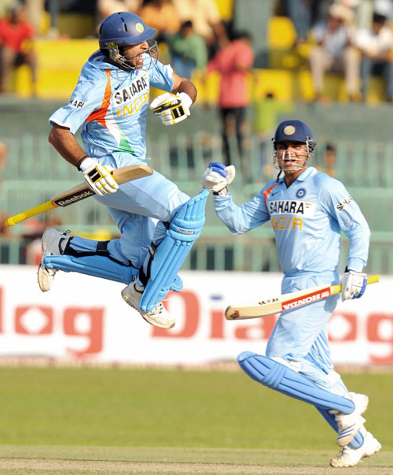 Yuvraj Singh is jubilant, and so is Virender Sehwag, as he reaches his century, Sri Lanka v India, 3rd ODI, Colombo, February 3, 2009