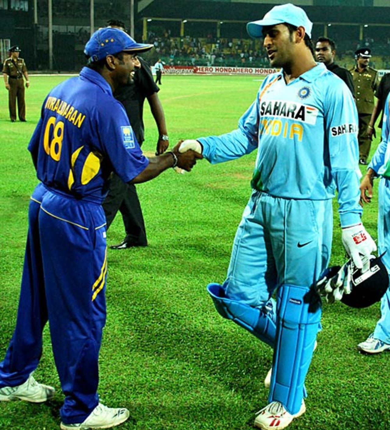 Mahendra Singh Dhoni congratulates Muttiah Muralitharan at the end of the game, Sri Lanka v India, 3rd ODI, Colombo, February 3, 2009