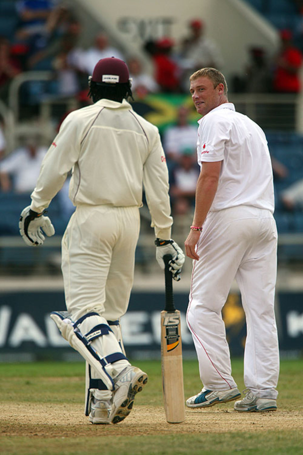 Andrew Flintoff looks back quizzically at Chris Gayle after being driven for a second-ball six, West Indies v England, 1st Test, Kingston, 2nd day, February 5, 2009