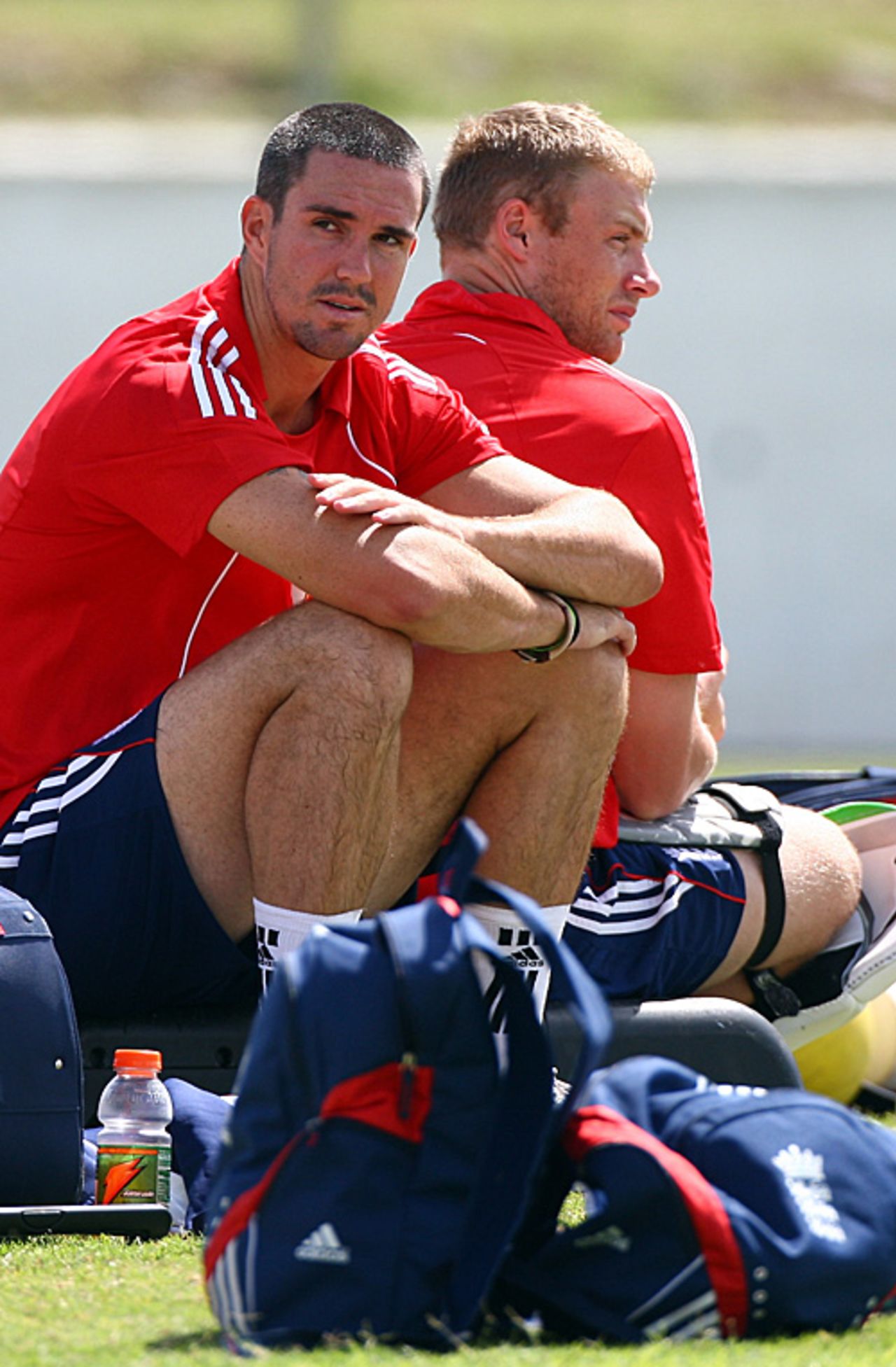 Kevin Pietersen and Andrew Flintoff sit back-to-back during a training session at the Antigua Recreation Ground, Antigua, February 10, 2009