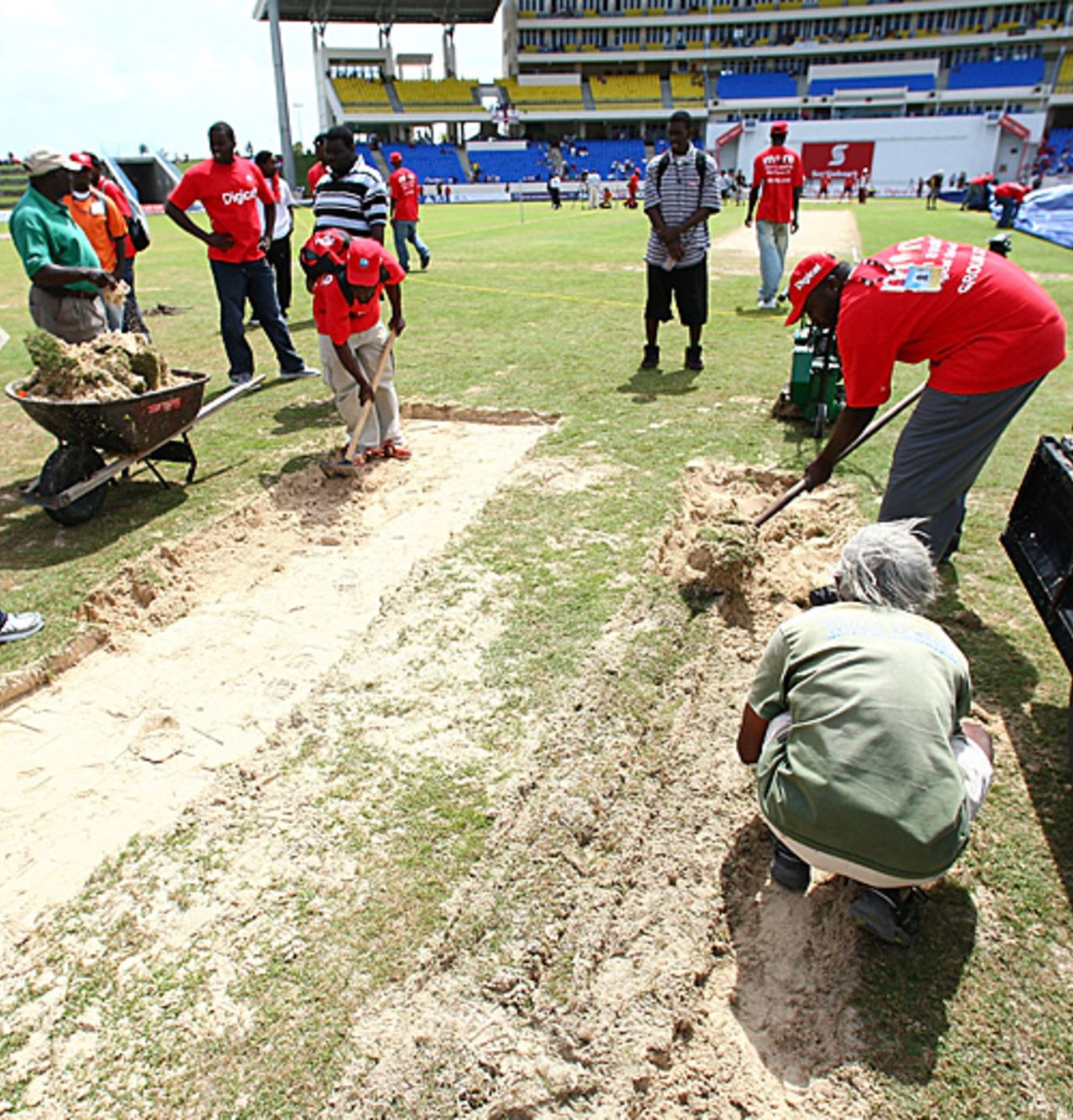 Where are the buckets and spades? Groundsmen dig beneath the surface but find just sand, sand, sand in Antigua, West Indies v England, 2nd Test, St. Johns, Antigua, February 13, 2009