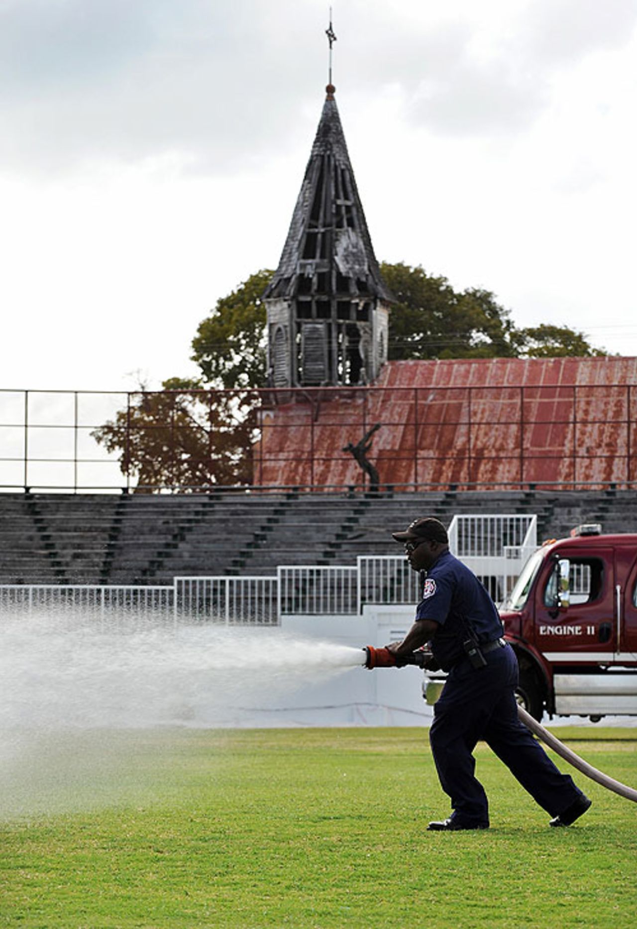 Firefighters are called in to water the outfield at the Antigua Recreation Ground, after its last-minute call-up to host the island's abandoned Test, West Indies v England, 2nd Test, St. John's, Antigua, February 13, 2009