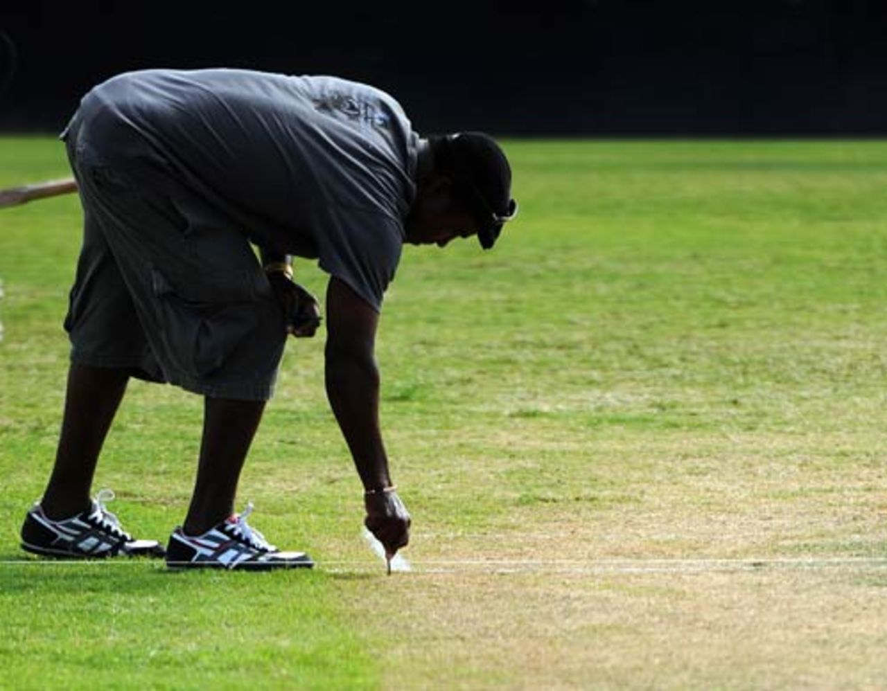 A groundsman marks the pitch as the Antigua Recreation Ground readies to host the third Test, West Indies v England, 2nd Test, St. John's, Antigua, February 13, 2009