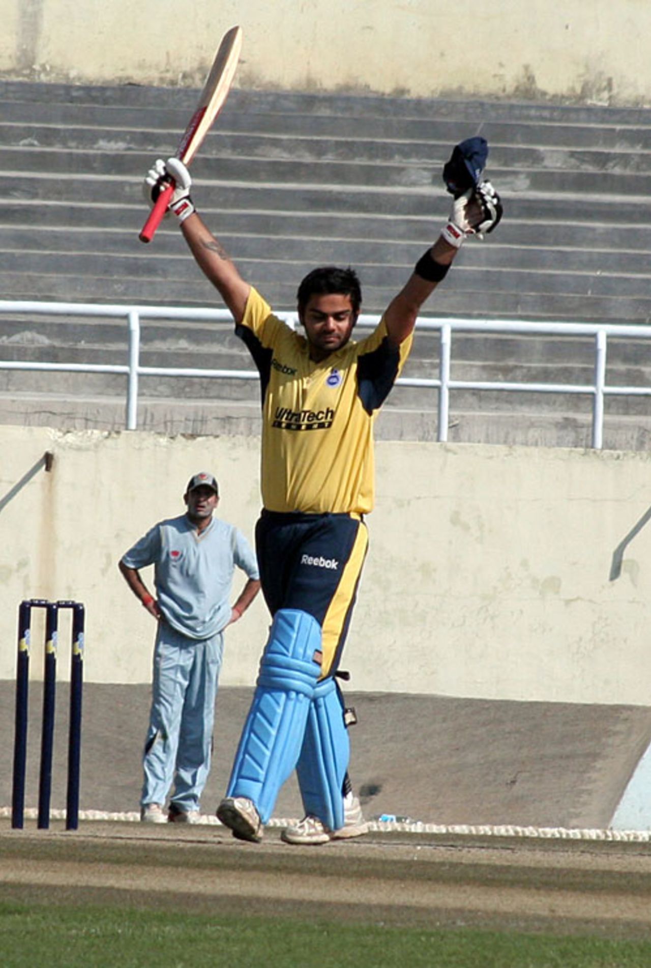 Virat Kohli raises his bat after getting a hundred, Jammu & Kashmir v Delhi, Ranji one-dayers, Dharamsala, February 15, 2009