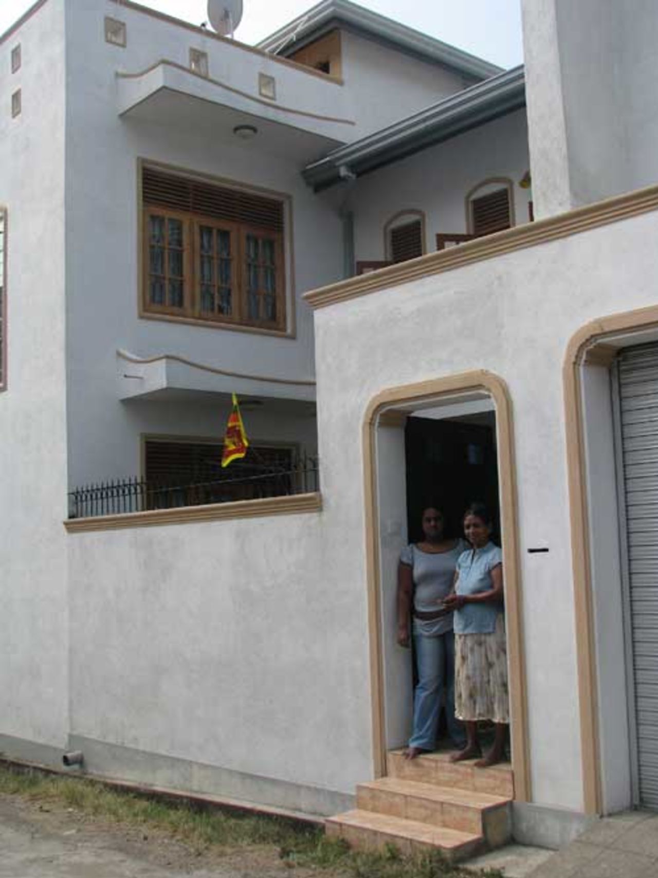 Ajantha Mendis' sister, Aruni, and mother, Ranjani, outside their home in Moratuwa near Colombo, February 2009