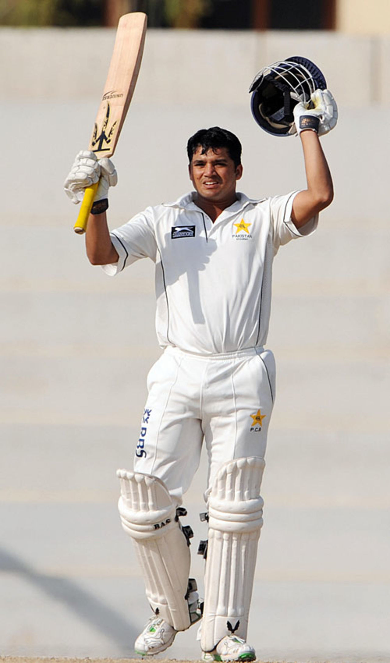 Azhar Ali raises the bat after reaching his century, Patron's XI v Sri Lankans, 1st day, Karachi, February 17, 2009