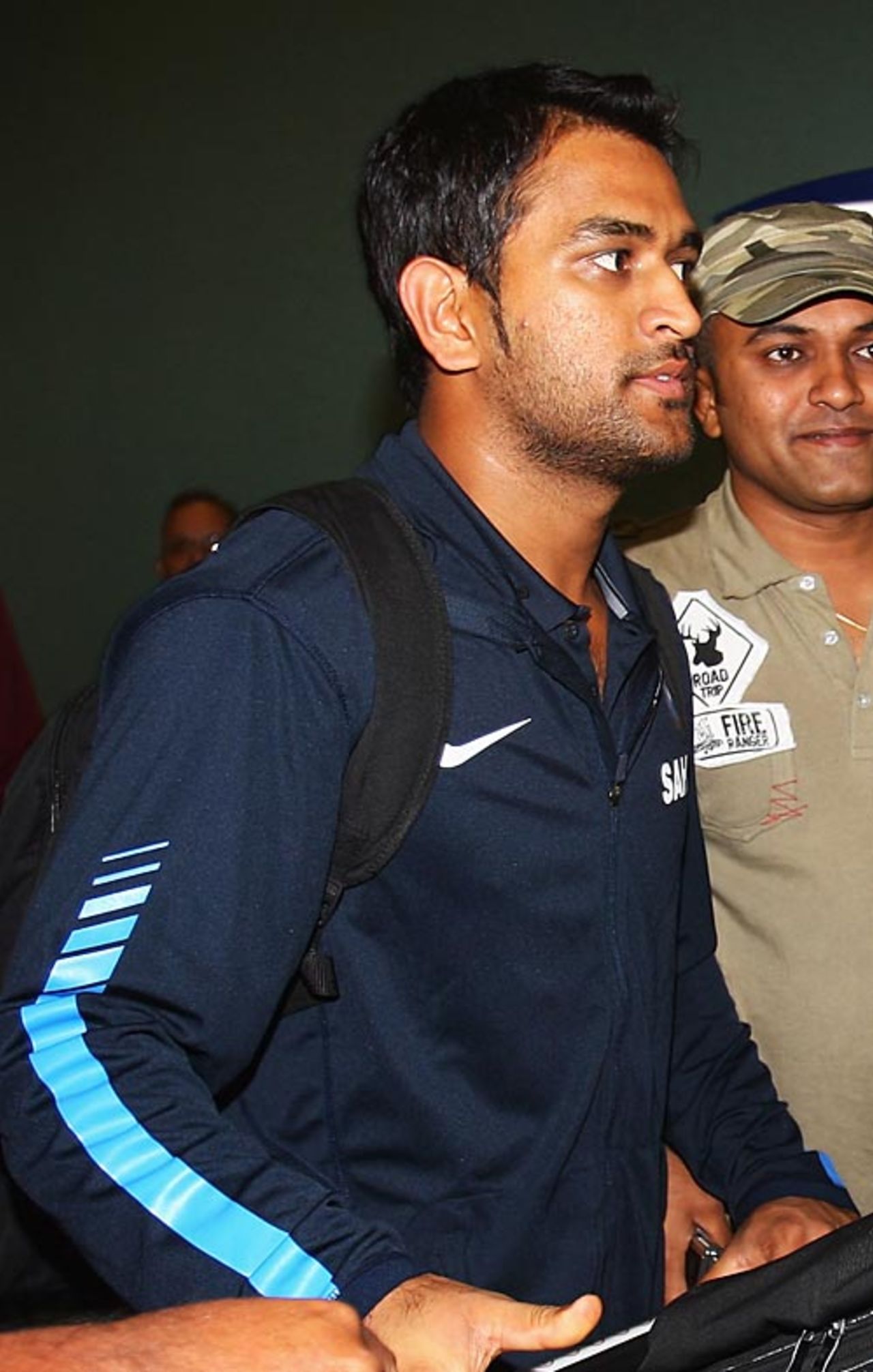 Mahendra Singh Dhoni makes his way out of the airport, Auckland, February 20, 2009